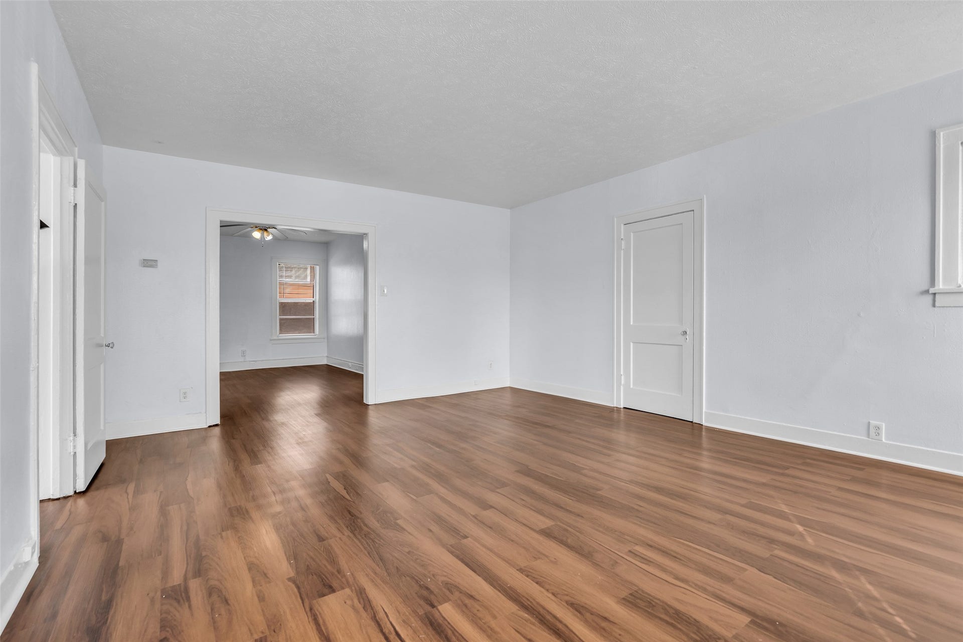 An additional view of the dining area highlights its connection to other spaces throughout the home, creating a convenient flow between the dining area and adjoining rooms.