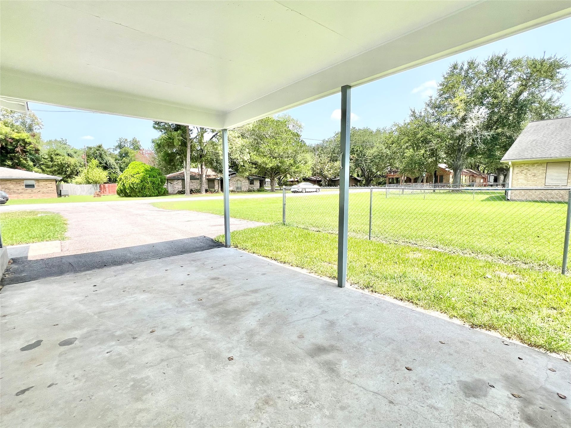 11815 15th Street, Santa Fe, TX 77510 View from under the carport, nice homes all around.