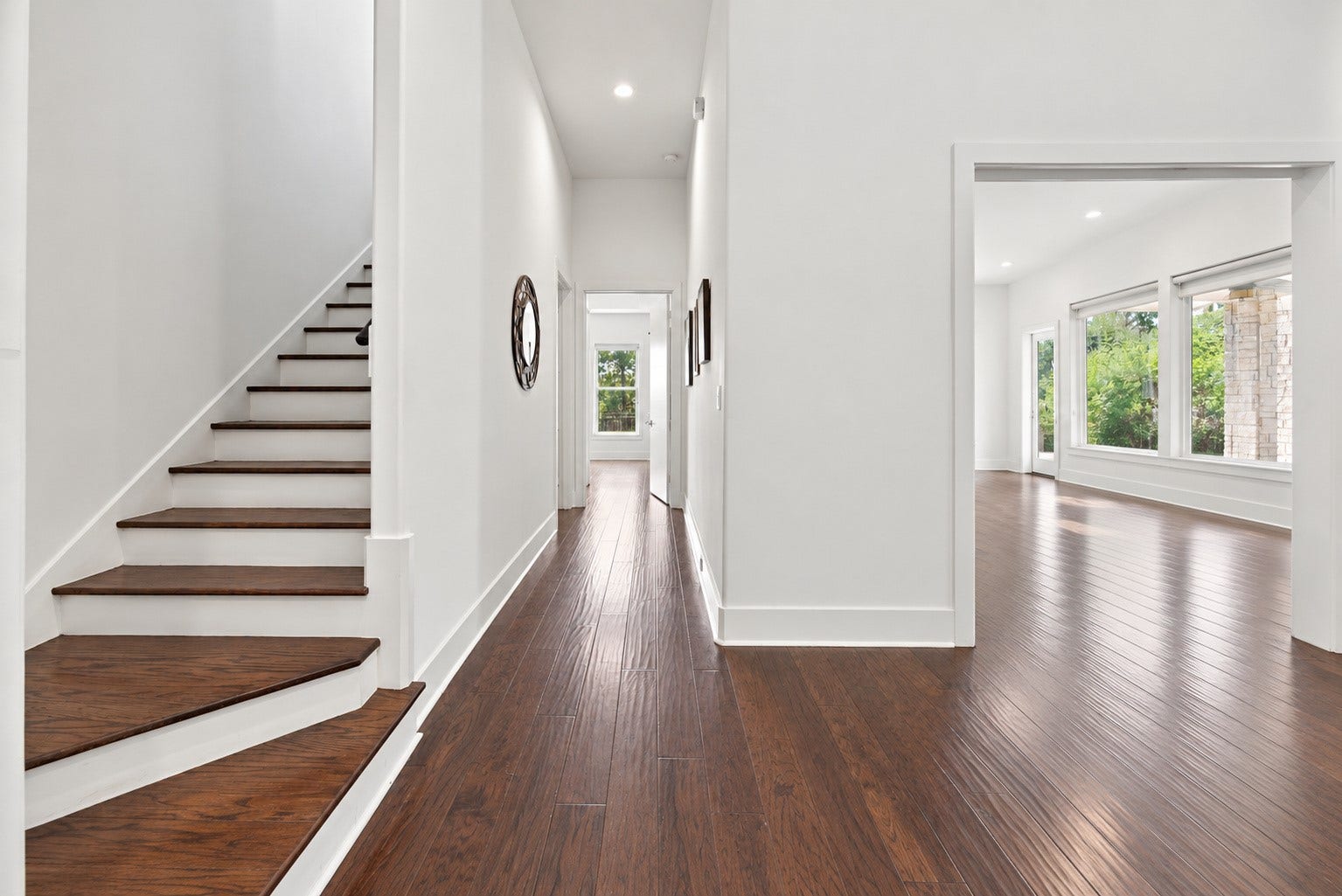 46 Lamerie Way, The Woodlands, TX 77382 Inviting entry hallway featuring rich hardwood floors, a beautiful staircase, and an open layout filled with natural light.