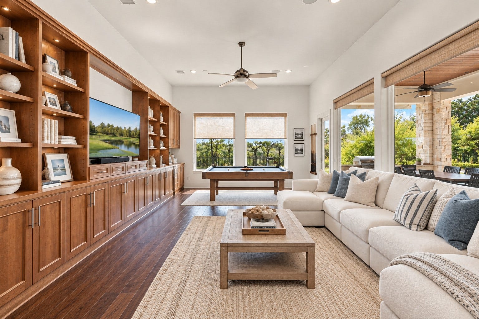 46 Lamerie Way, The Woodlands, TX 77382 Game room featuring beautiful hardwood floors, custom built-ins, and an abundance of natural light. A comfortable and inviting space perfect for entertaining, relaxing, or enjoying time with family and friends.