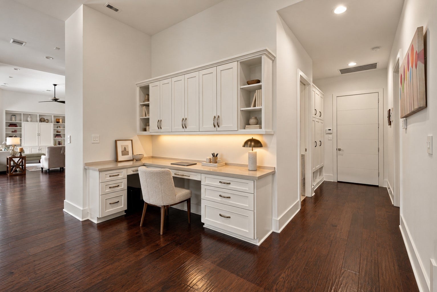 46 Lamerie Way, The Woodlands, TX 77382 Beautifully designed built-in workspace featuring custom cabinetry, generous counter space, and rich hardwood floors, offering both style and functionality.