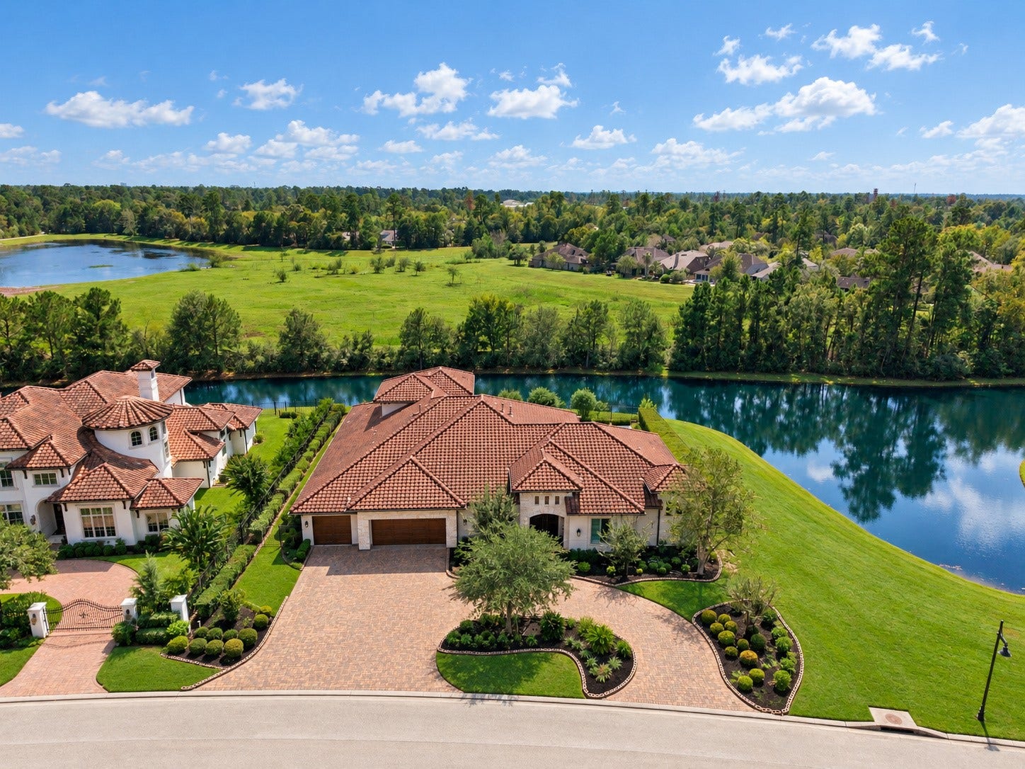 46 Lamerie Way, The Woodlands, TX 77382 Exceptional luxury estate situated on a picturesque peninsula, surrounded by tranquil water on both sides and offering breathtaking panoramic views.