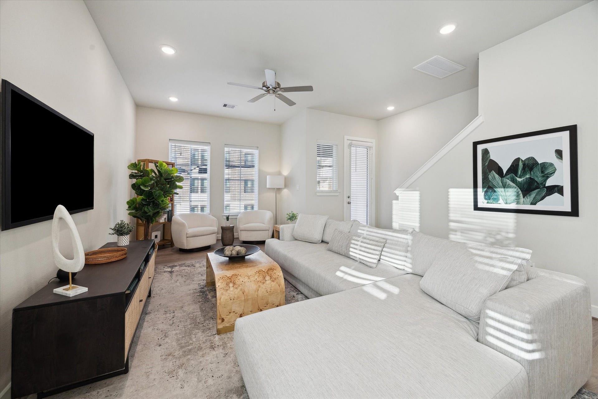 3083 Hicks Street, Houston, TX 77007 Representative photo showing the communitys model home living room. Layout and selections may vary.