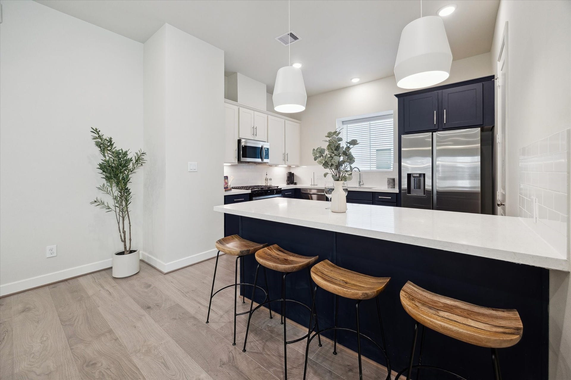 3083 Hicks Street, Houston, TX 77007 Representative photo showing the communitys model home kitchen. Layout and selections may vary.