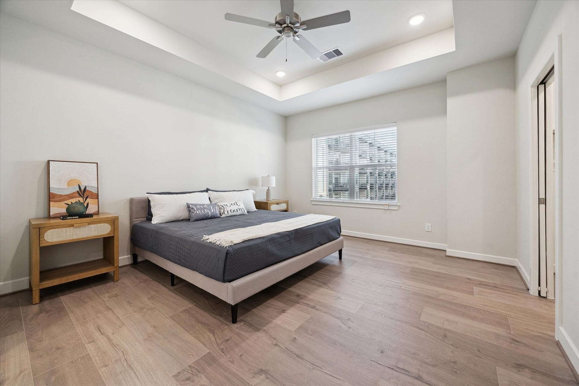 3083 Hicks Street, Houston, TX 77007 Representative photo showing the communitys model home primary bedroom. Layout and selections may vary.
