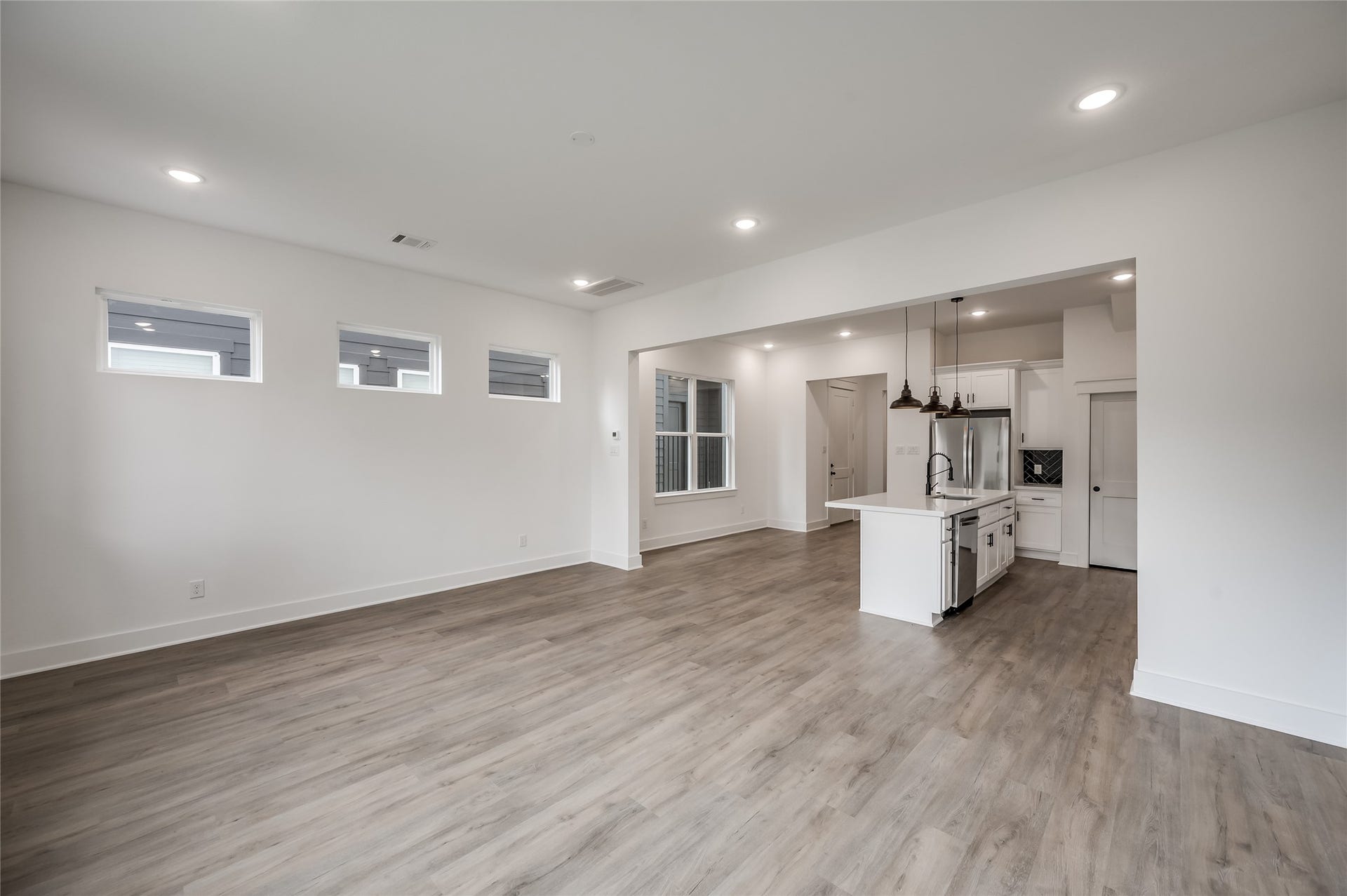 4605 Terry Street, Houston, TX 77009 A wide angle view captures just how open the living room and kitchen feel together, made for gathering