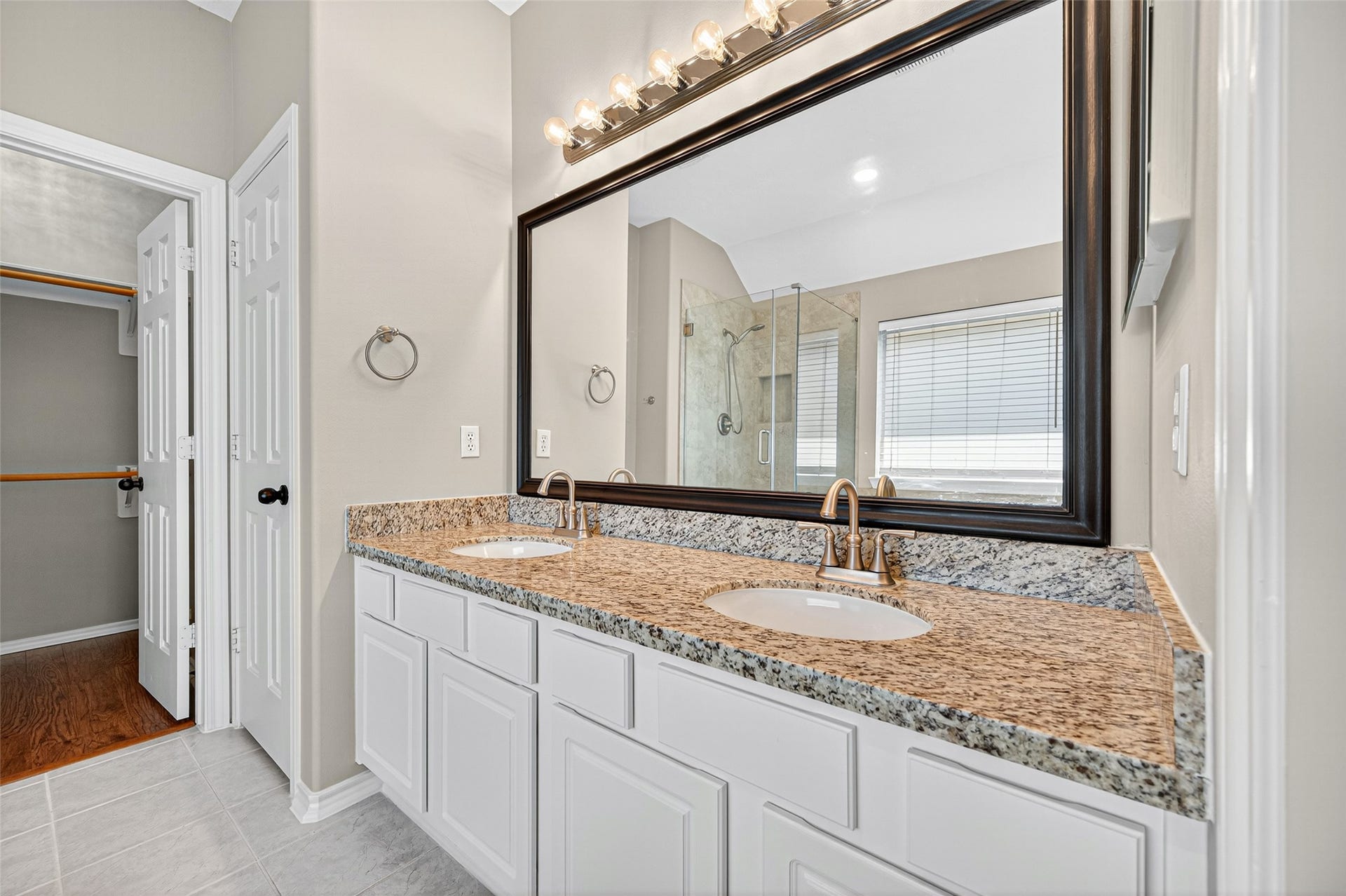 21914 Bronze Leaf Drive, Cypress, TX 77433 Dual sink vanity with framed mirror