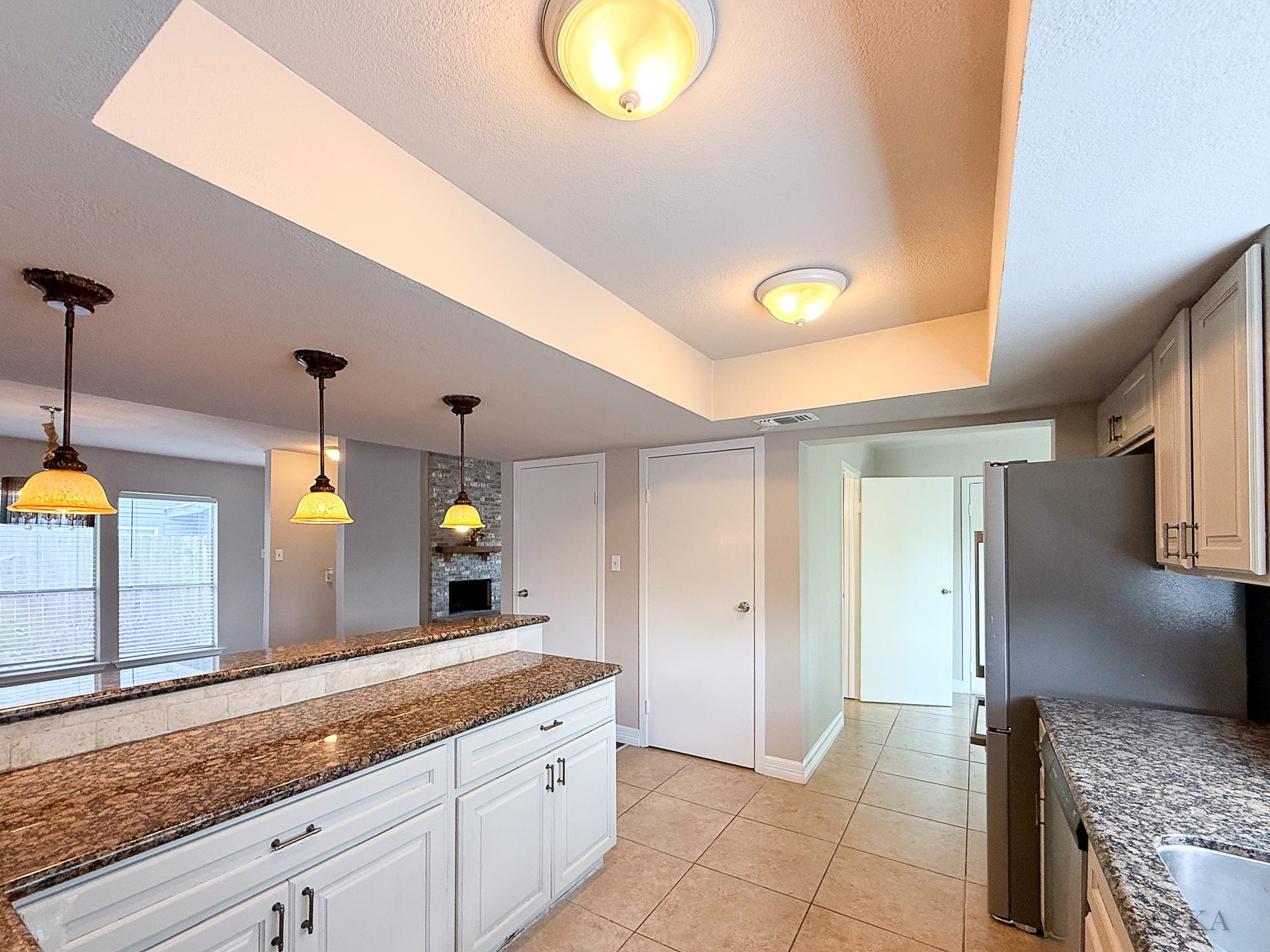 Down the hall is the flex room where you can add shelves for all of your pantry needs. The half bath and utility room is also located in this area.
