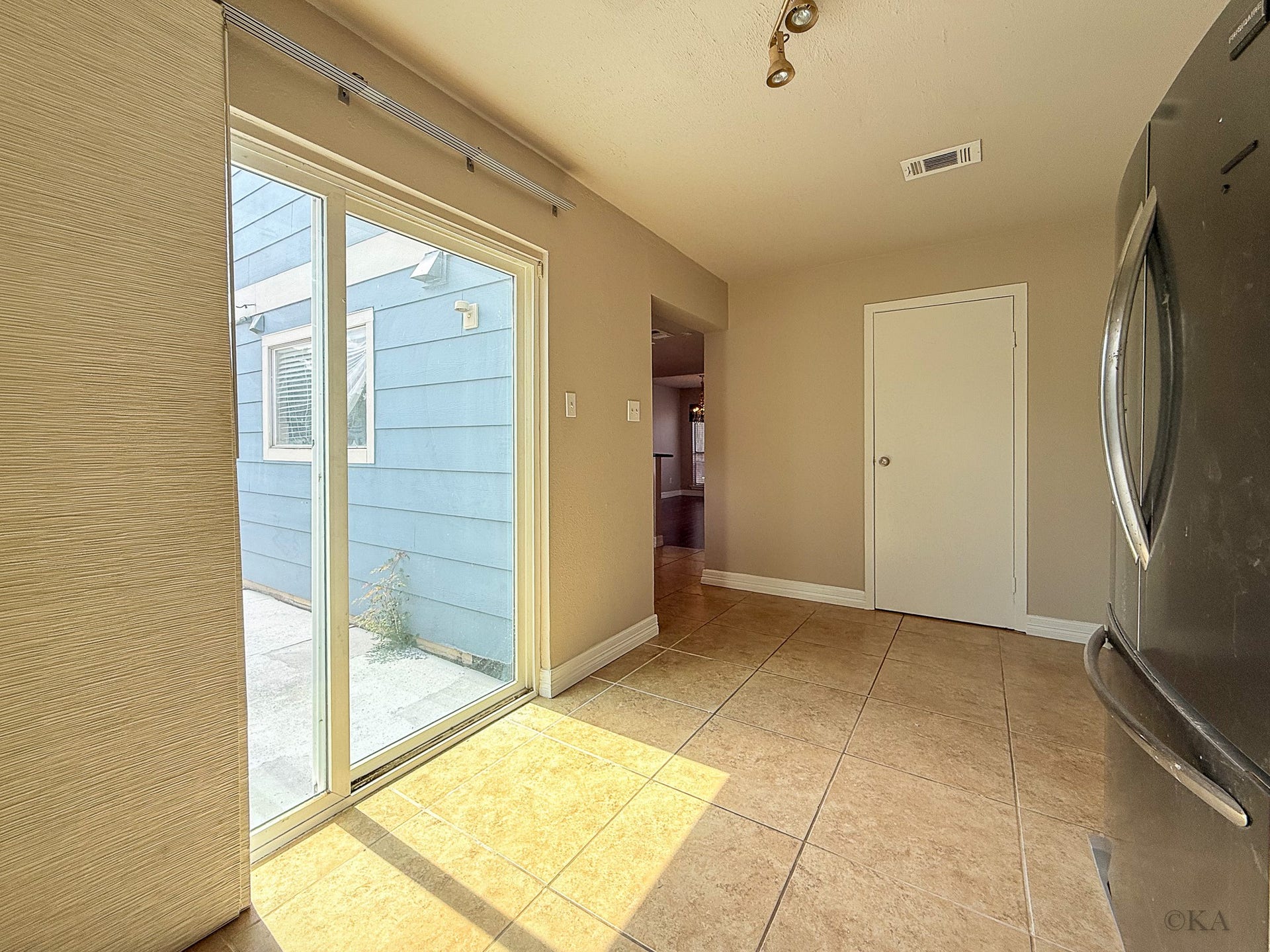 Second set of sliding doors to access the backyard.