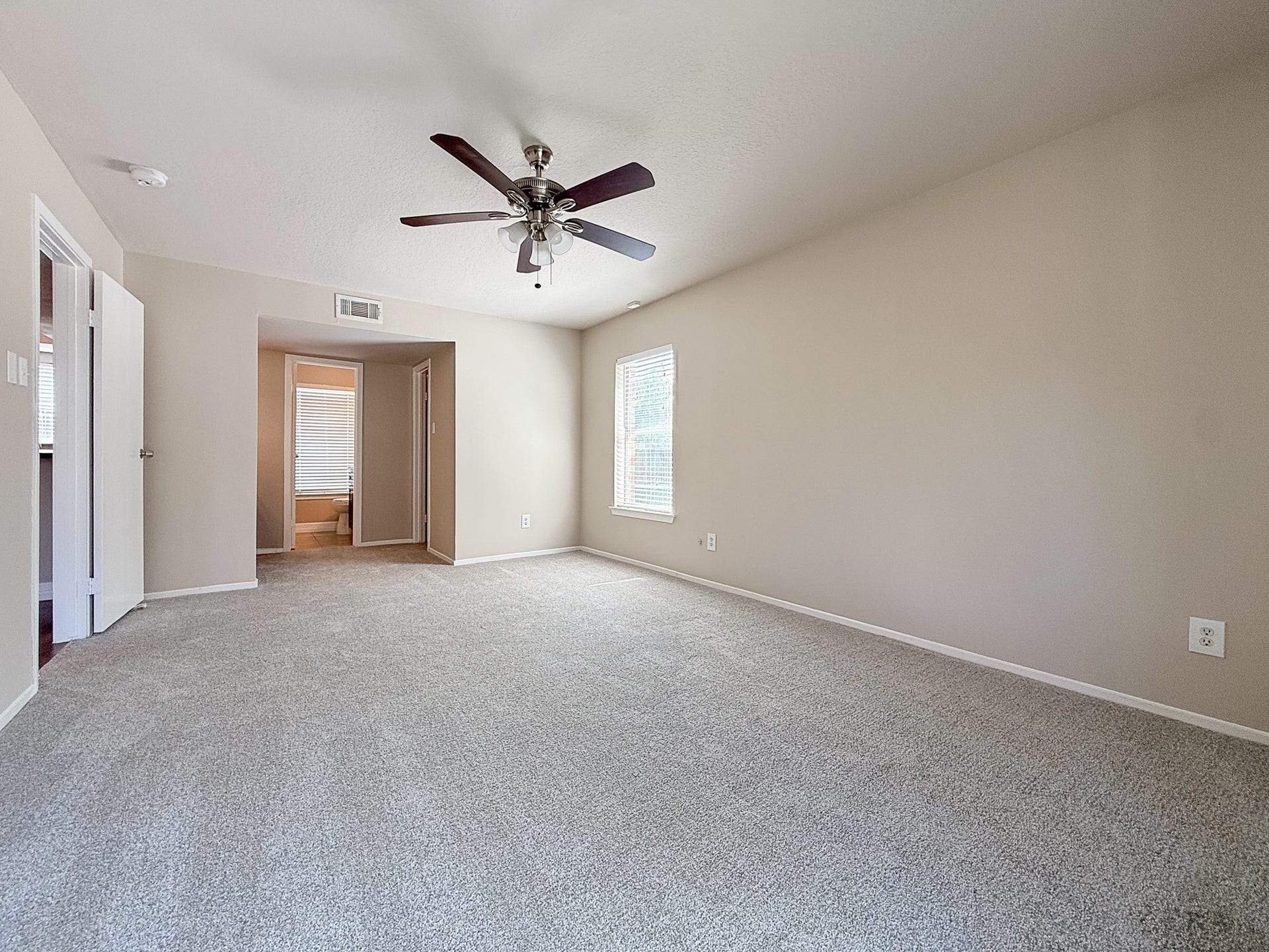 The primary suite is spacious and features brand new carpet and paint.
