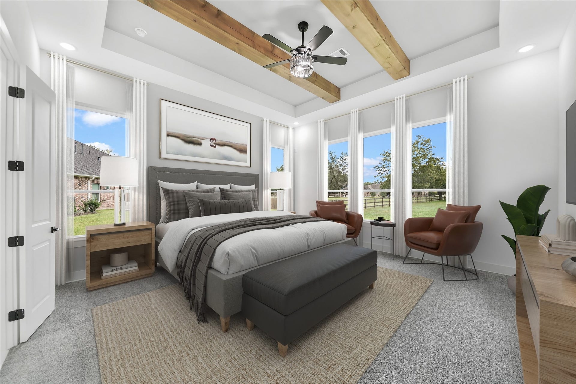 Indulge in the allure of the magnificent primary bedroom, a sanctuary of luxury featuring high ceilings and exposed wood beams that evoke an air of grandeur. Large windows welcome natural light, casting a warm glow across the space. Double doors beckon towards the beautiful ensuite, creating a seamless transition to your private oasis. Discover the convenience of wall TV connections, allowing for personalized entertainment in this exquisitely designed retreat. Virtually staged.