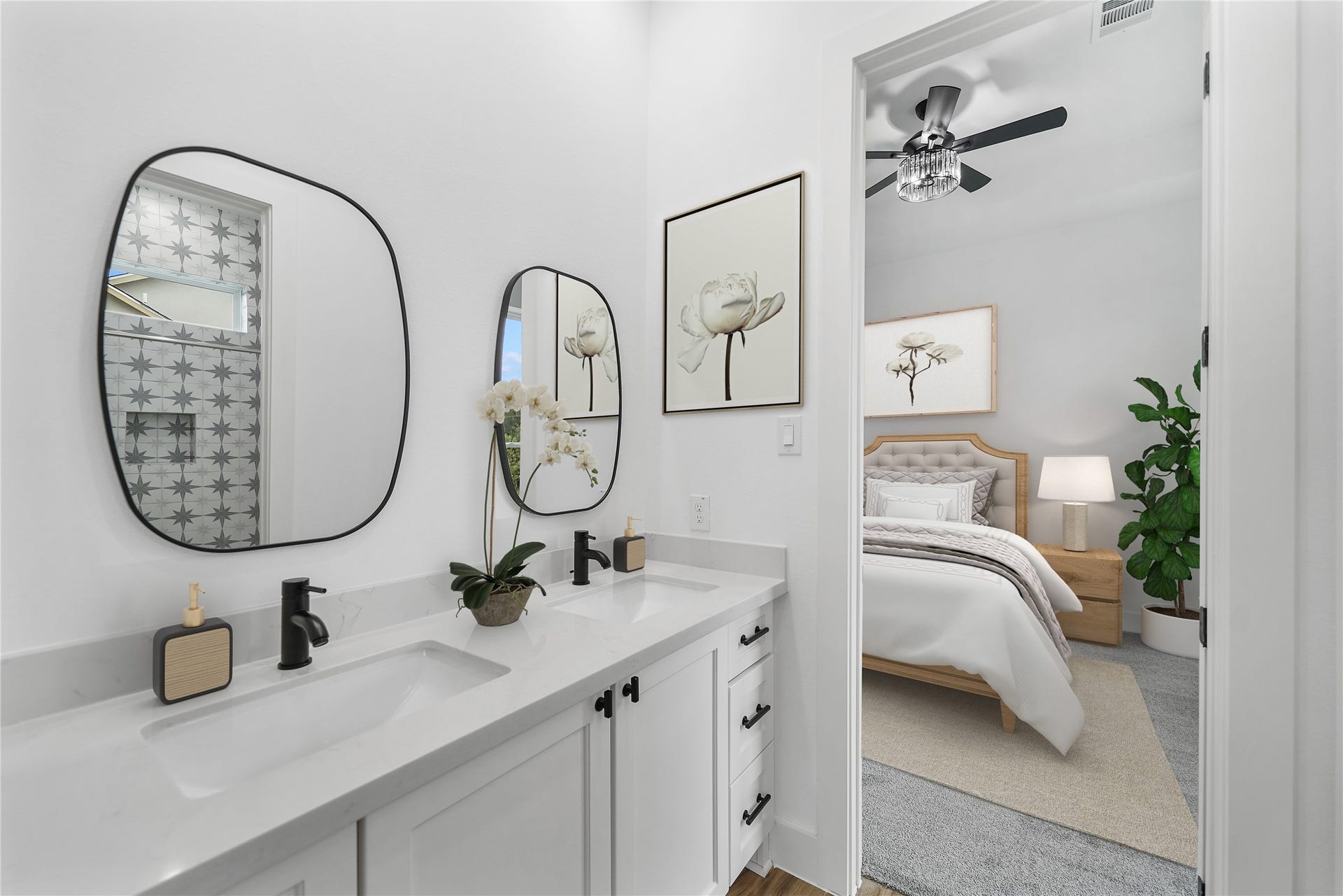 Step into the Hollywood bath, a stylish and versatile space designed with both aesthetics and functionality in mind. Featuring the same high-quality plumbing and electrical fixtures found throughout the home, this bathroom combines convenience and elegance. Virtually staged.