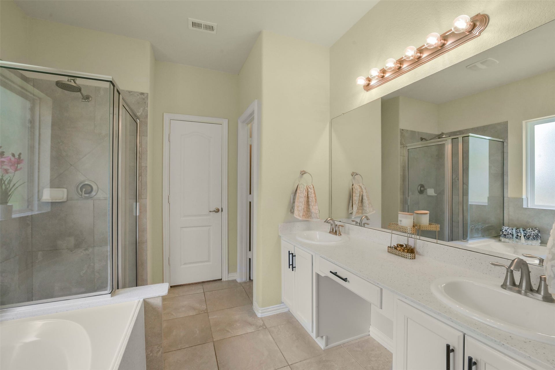 82 Road 6607, Dayton, TX 77535 Pic 1 of the primary bath. Double sinks, vanity, large soaking tub and standup shower.