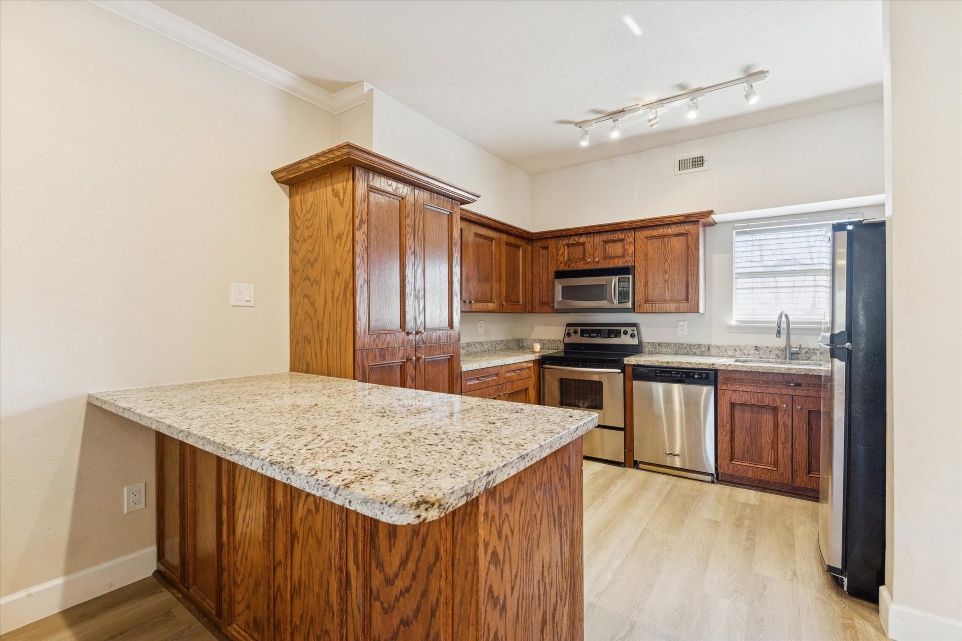 4041 Law Street, #512, Houston, TX 77005 Closer view of kitchen with granite counters and stainless appliances.