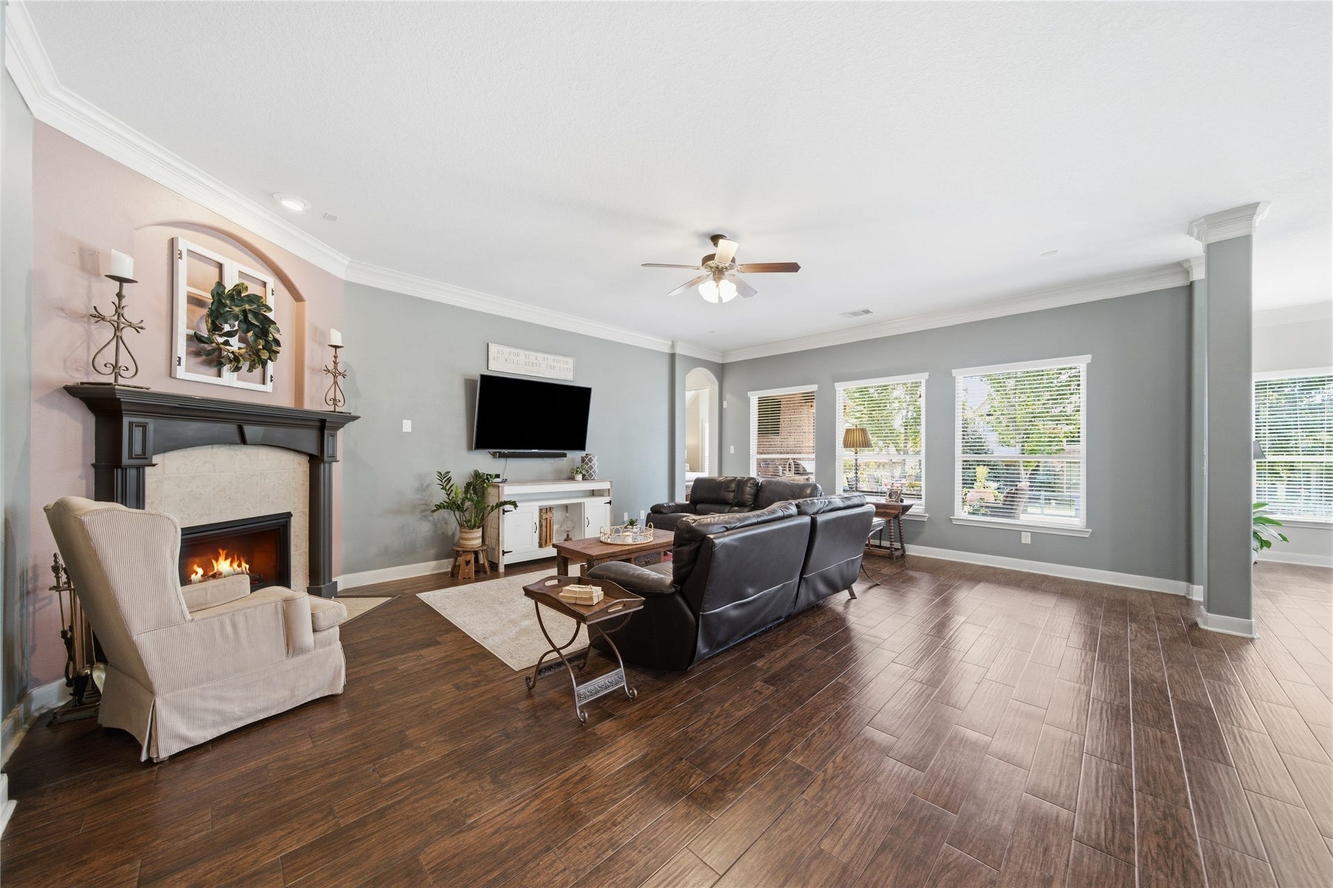 30511 Sethora Hill Way, Fulshear, TX 77441 A welcoming fireplace adds warmth to a space made for gathering and making memories.