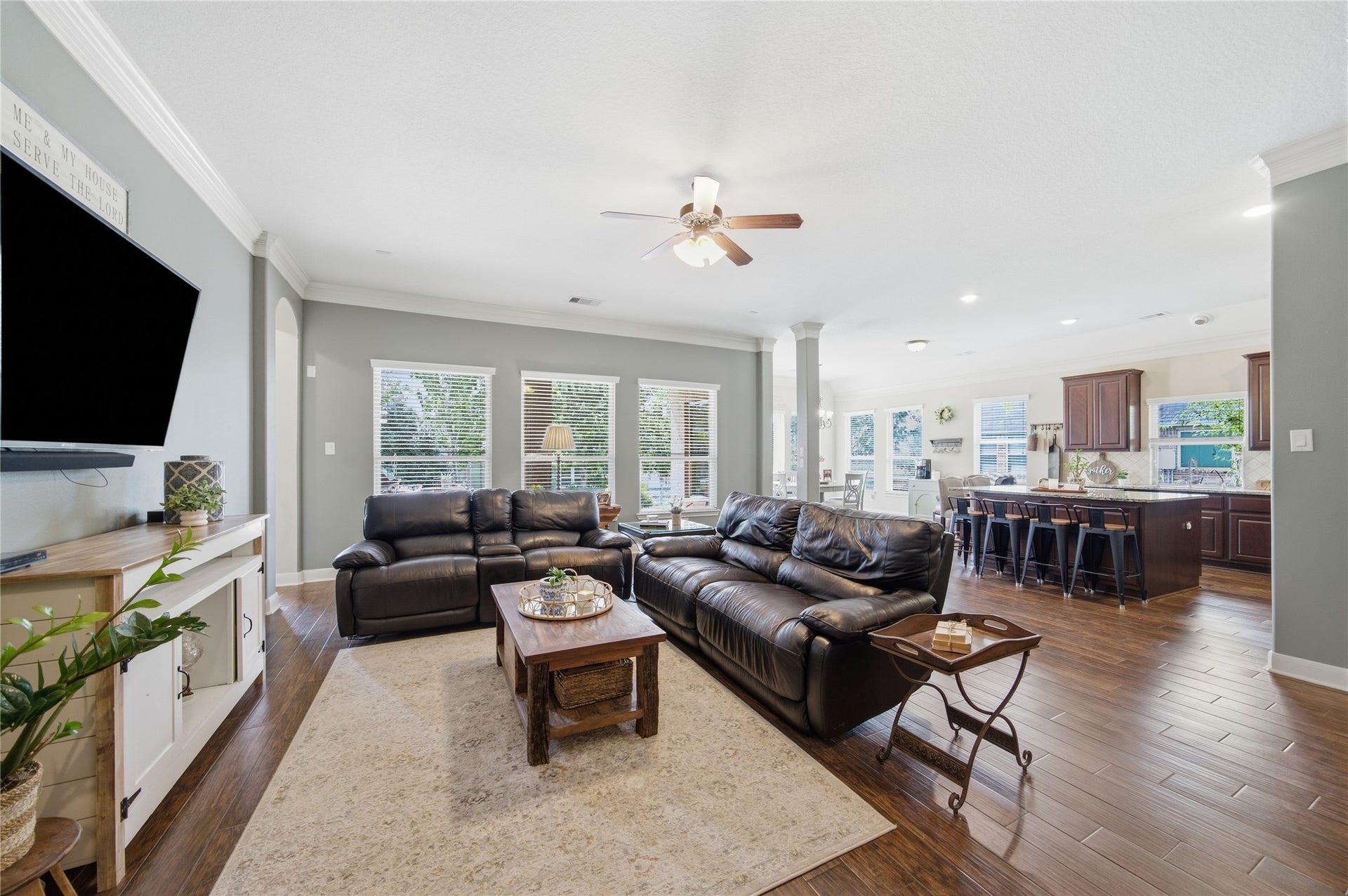 30511 Sethora Hill Way, Fulshear, TX 77441 Just off the kitchen, this spacious living room is where game nights turn into friendly competition, movies bring everyone together, and more memories have been made cheering on the favorite teams.