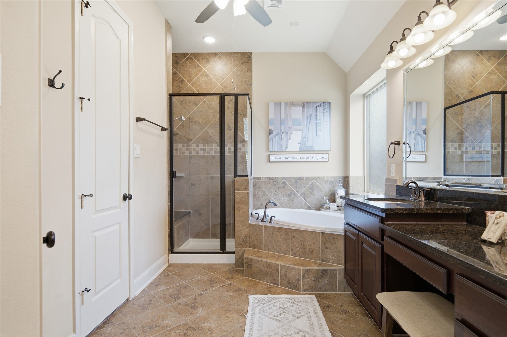 30511 Sethora Hill Way, Fulshear, TX 77441 With a separate shower and raised double vanity, the primary bathroom offers space to ease into your mornings and unwind at night.