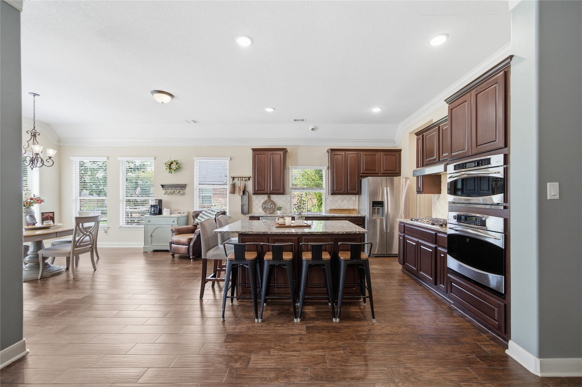 30511 Sethora Hill Way, Fulshear, TX 77441 This spacious kitchen features a large island with plenty of seating for guests, abundant cabinetry, and beautiful natural lightan inviting space to gather, cook, and entertain.