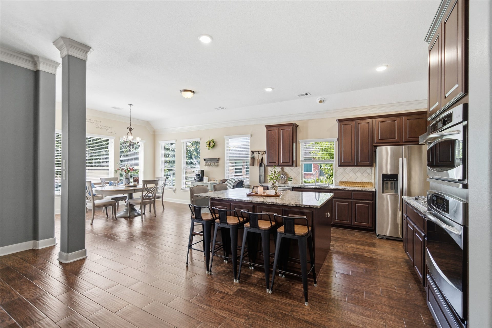 30511 Sethora Hill Way, Fulshear, TX 77441 Some of the best memories are made around the kitchen islandfamily dinners, conversations that linger, and laughter that fills the room.
