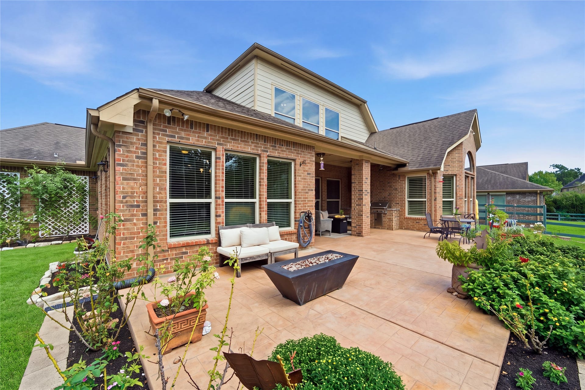 30511 Sethora Hill Way, Fulshear, TX 77441 As the evening cools, gather around the outdoor gas firepit for stories, laughter, and conversations that lingera welcoming spot to make memories under the stars.