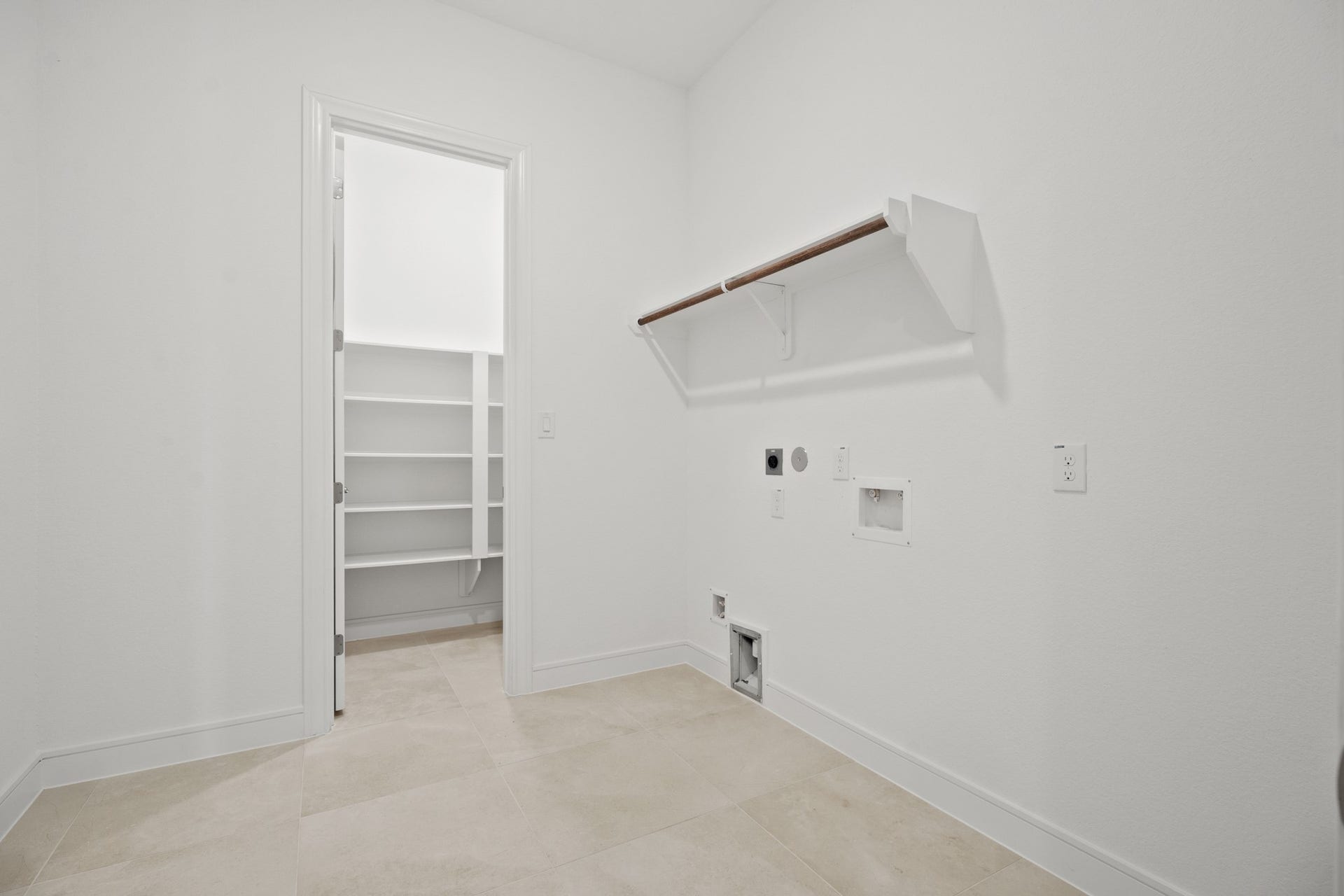Laundry room with storage (*Photo not of actual home and used for illustration purposes only.)