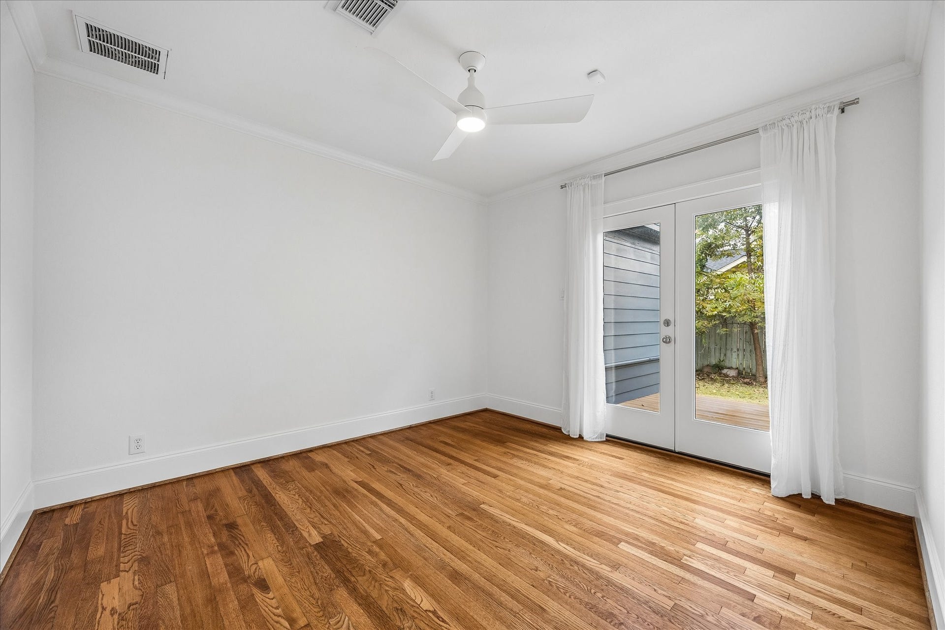636 Pizer Street, Houston, TX 77009 The second bedroom has hardwood floors and French doors that open to a private deck