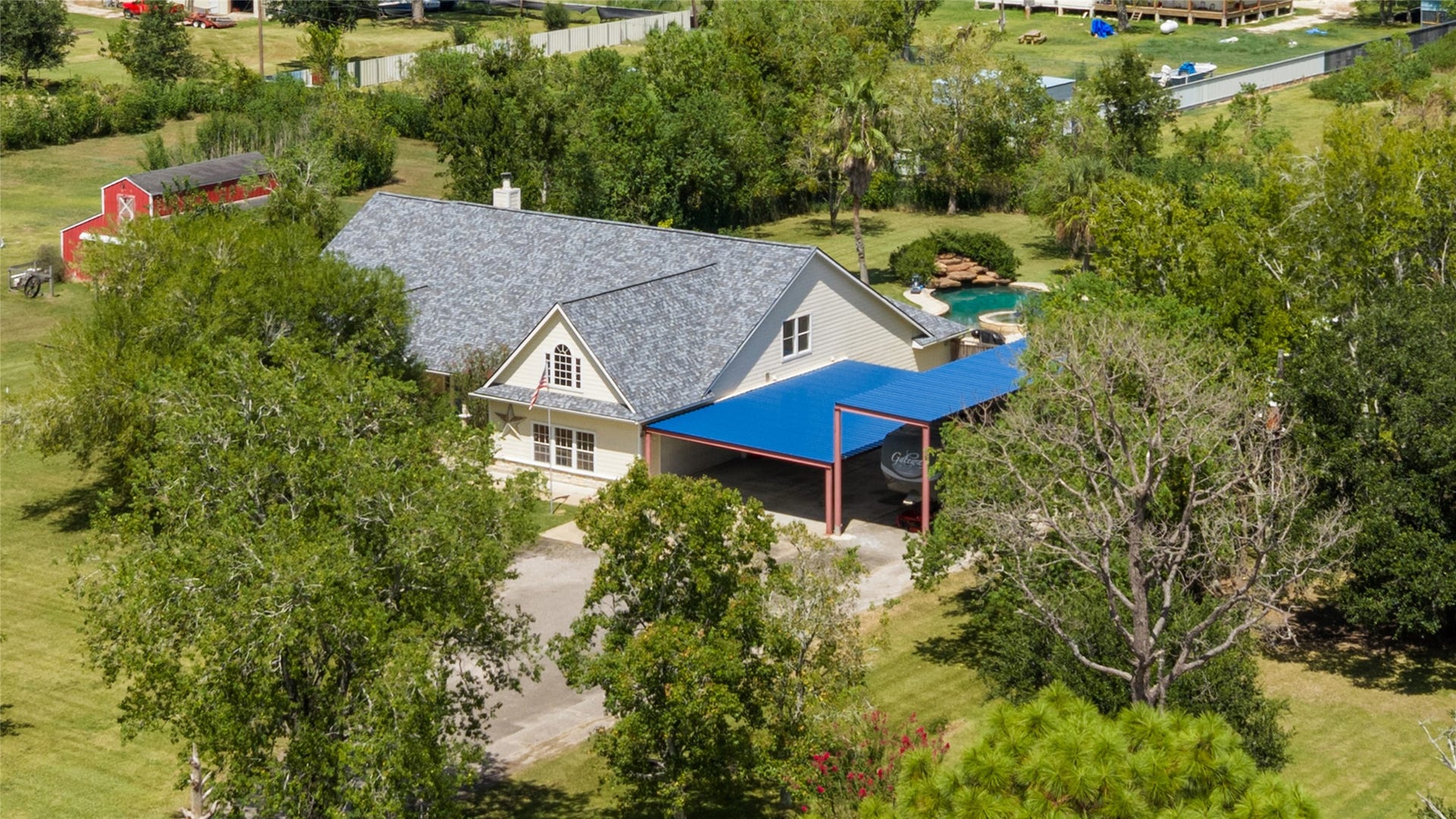 111 County Road 932, Alvin, TX 77511 One last look at the home, all that covered parking, and the space that makes this property so easy to love.