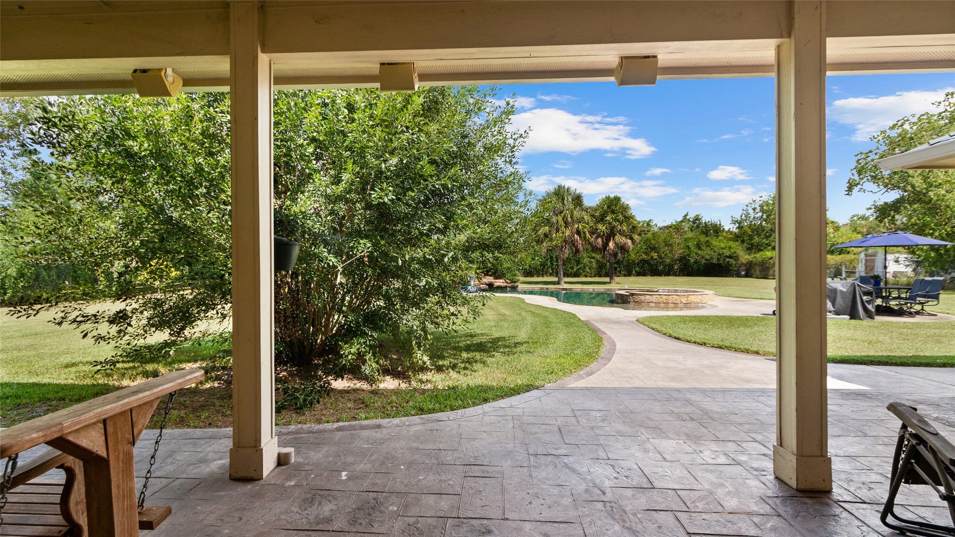 111 County Road 932, Alvin, TX 77511 Step outside to the covered patio, a great spot to enjoy the backyard in a little more shade.