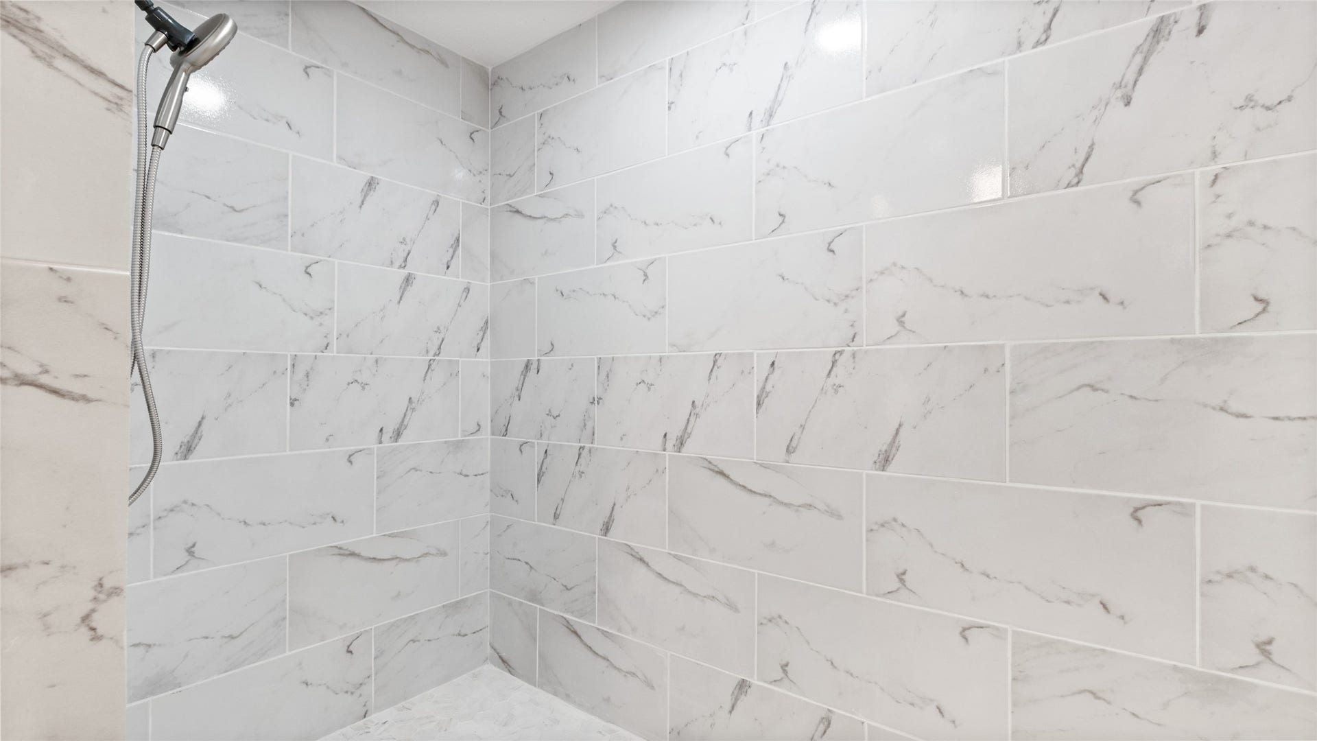 111 County Road 932, Alvin, TX 77511 The walk in shower offers wheelchair accessibility and plenty of space for easier movement.
