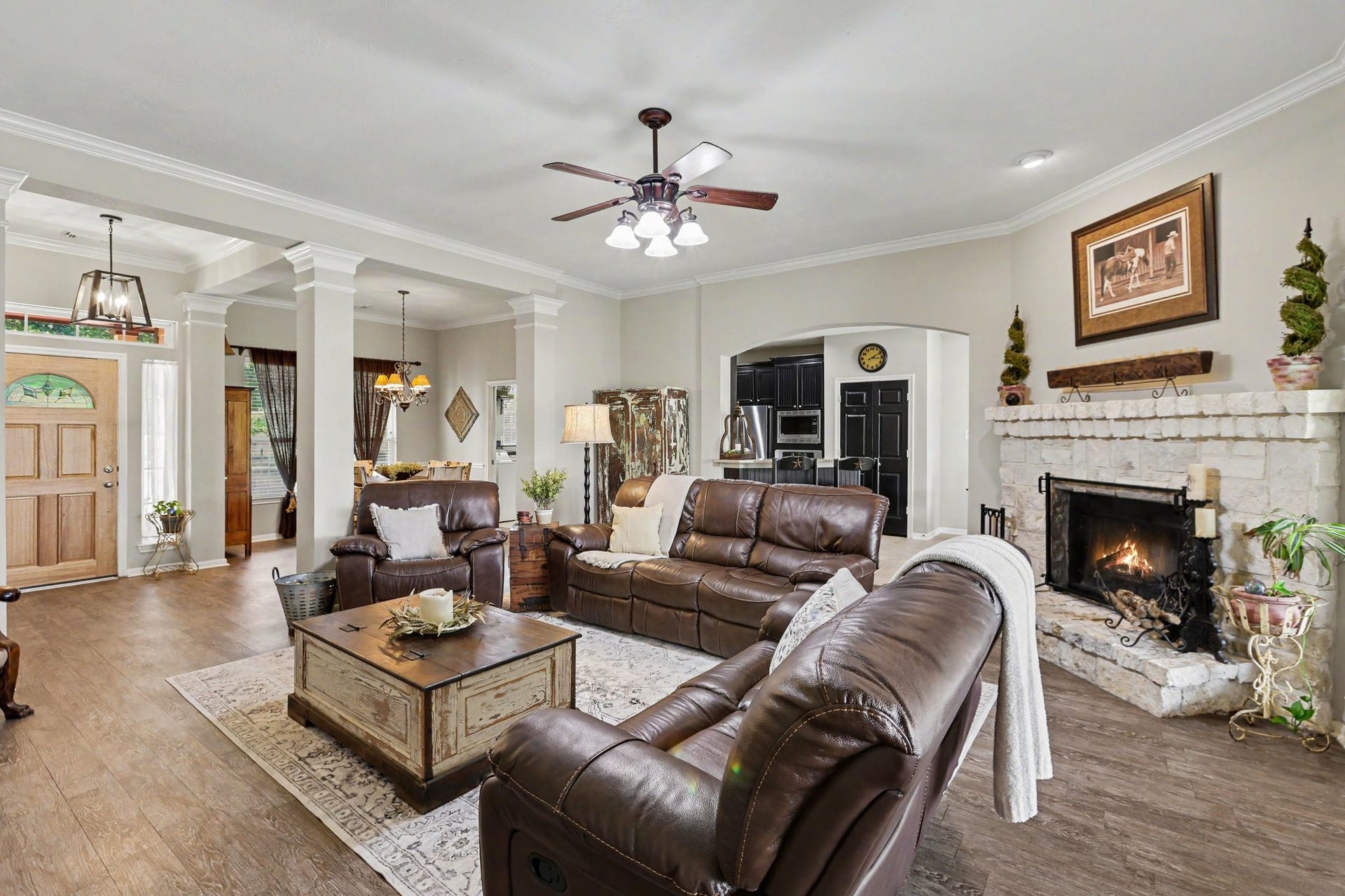 3014 Bowser Road, Fulshear, TX 77441 Living Room with Formal Dining Room and Kitchen behind