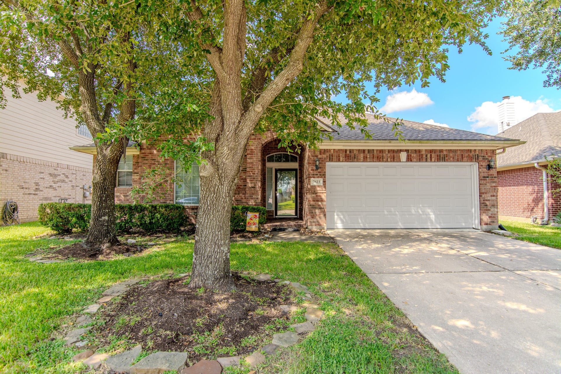 7823 Blue Stream Court, Houston, TX 77041 Charming brick home with a welcoming front yard, mature trees, and a spacious two-car garage. 3 bedrooms 2 bath + Sunroom or Home Office.