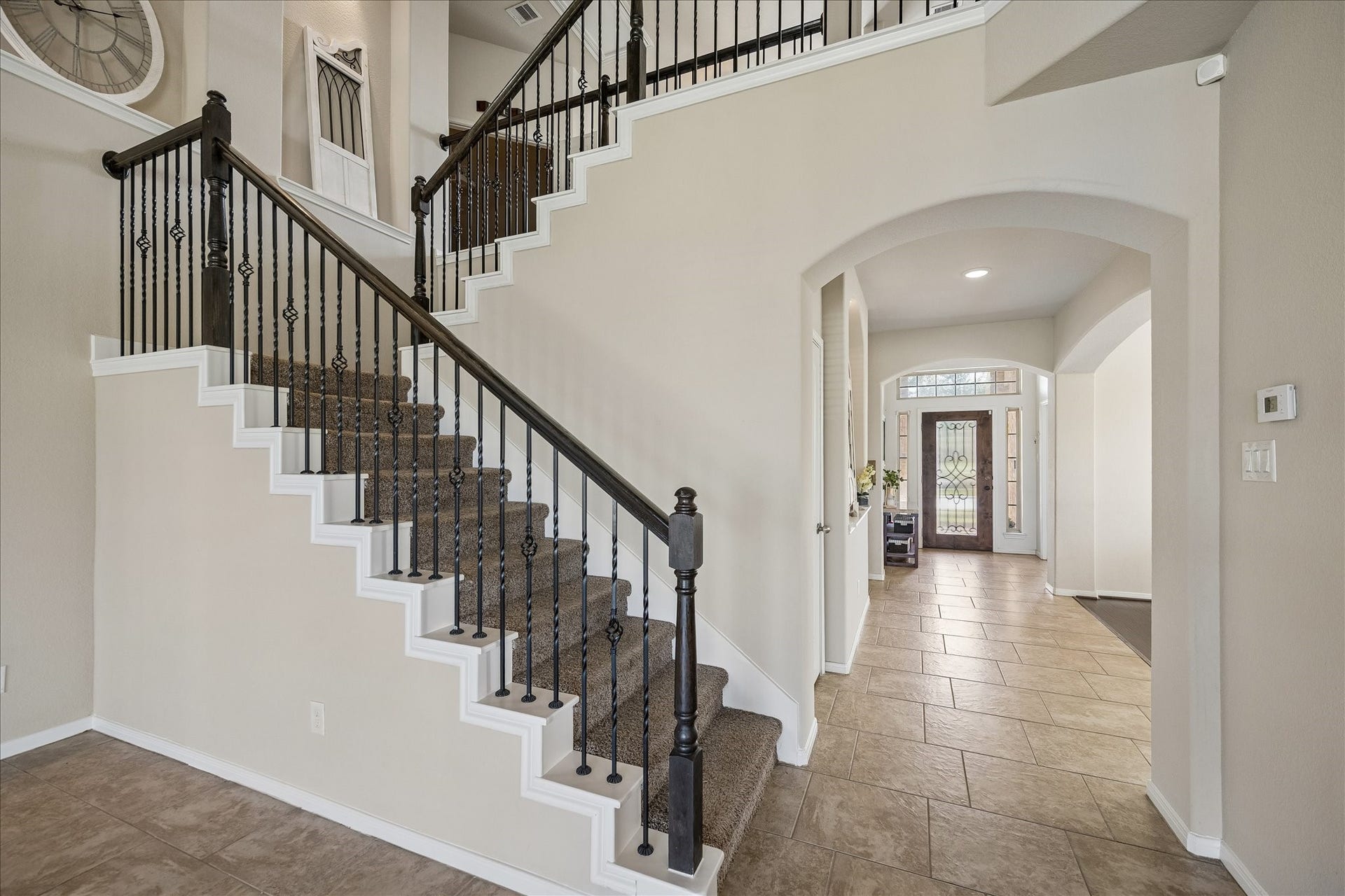 10018 Mahaffey Road, Tomball, TX 77375 Wrought-iron staircase.