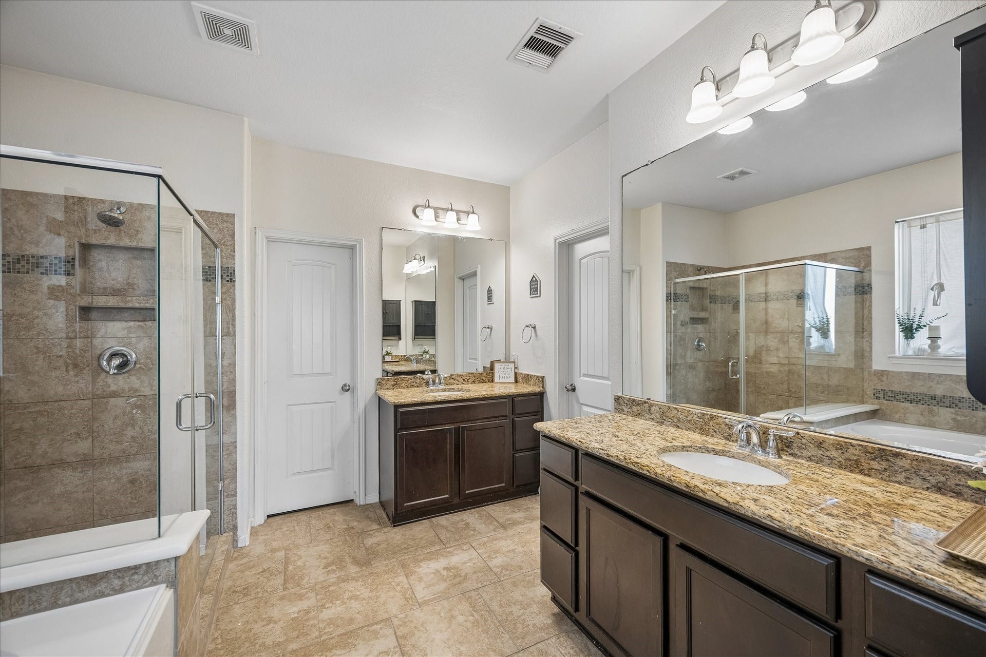 10018 Mahaffey Road, Tomball, TX 77375 Primary bathroom with separate vanities.