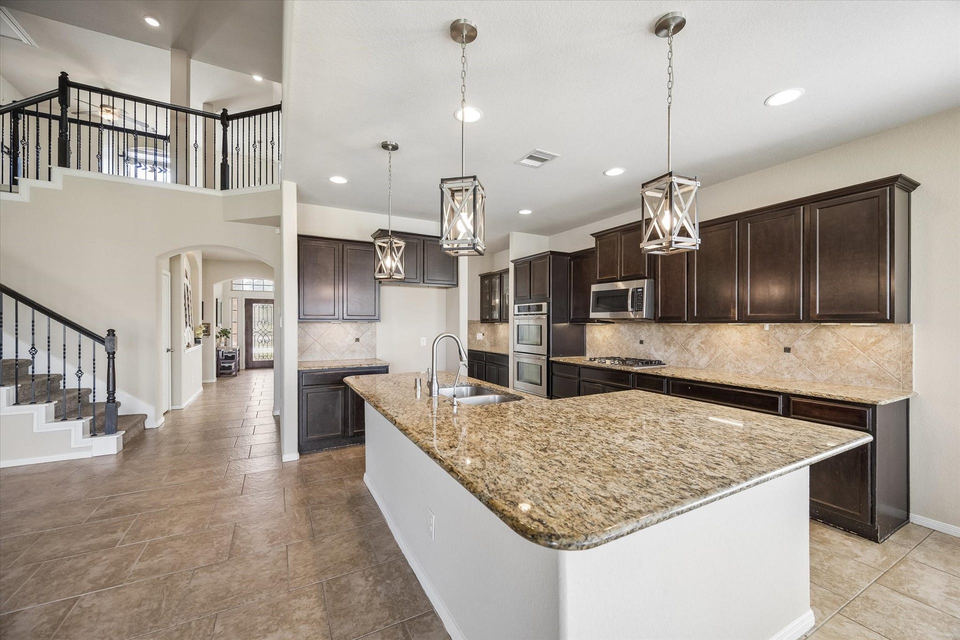 10018 Mahaffey Road, Tomball, TX 77375 Kitchen flows right into the living room.