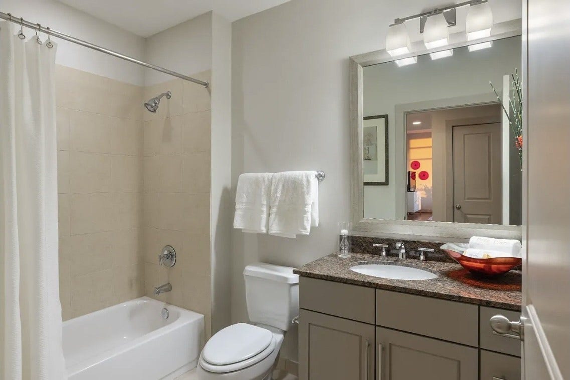 1400 McKinney Street, #2304, Houston, TX 77010 The secondary bathroom features granite countertops, stylish cabinetry and a full tub and shower combination. Thoughtfully designed for both comfort and functionality, it provides a welcoming space for family members and overnight guests.