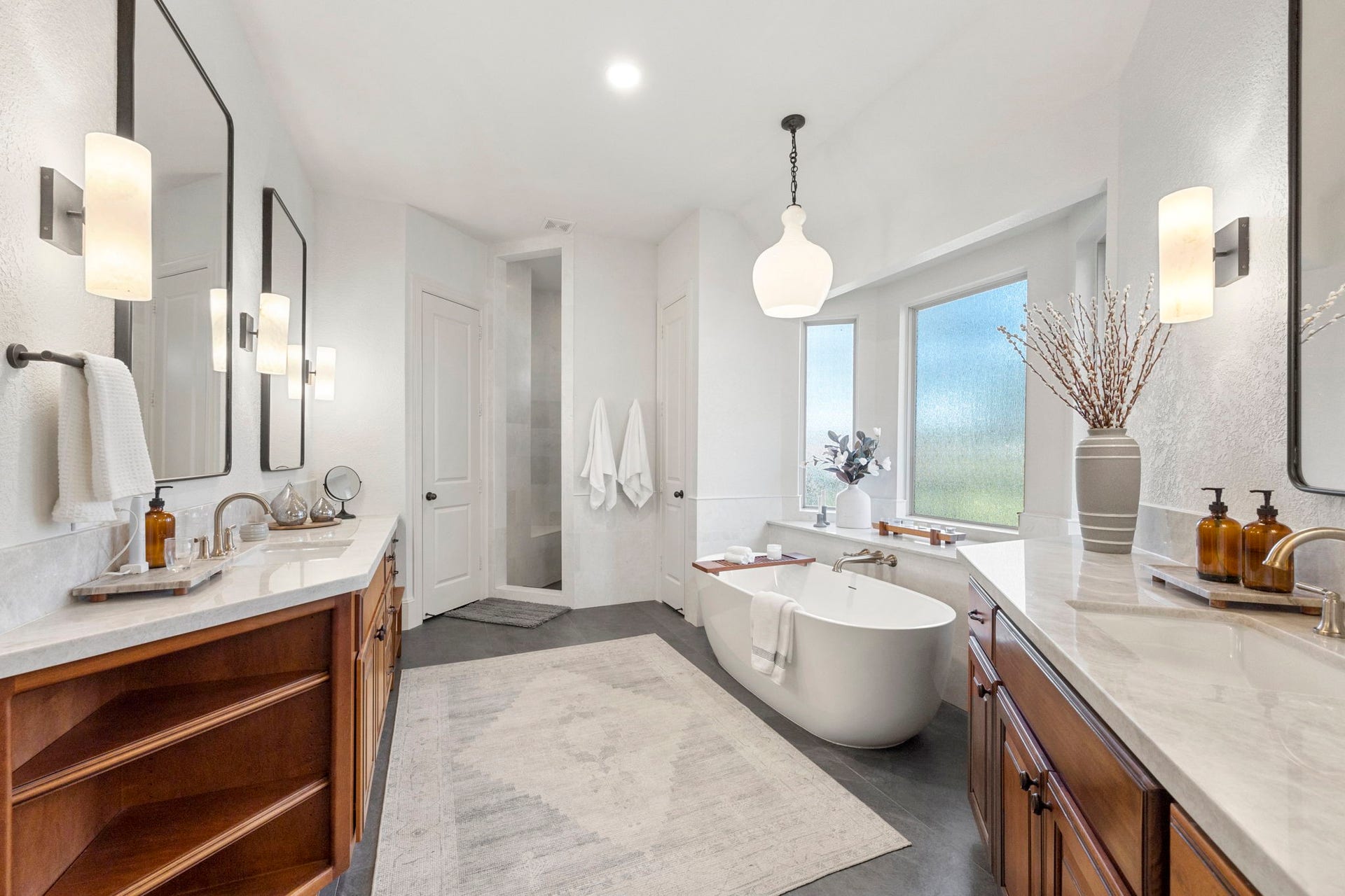 22 Parsonage Cove, Missouri City, TX 77459 Totally renovated primary bathroom features high end finishes throughout! Oversized tile, beautiful custom vanities, a separate soaking tub, and large walk in shower is all ready to take the stress of the day away!