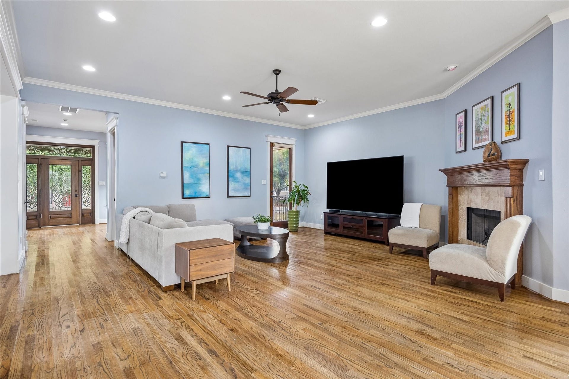 This spacious family room is made for everyday living, with plenty of room to stretch out, gather and actually get comfortable. Hardwood flooring, crown molding, recessed lighting and a handsome gas log fireplace add warmth and character without sacrificing that easygoing feel.