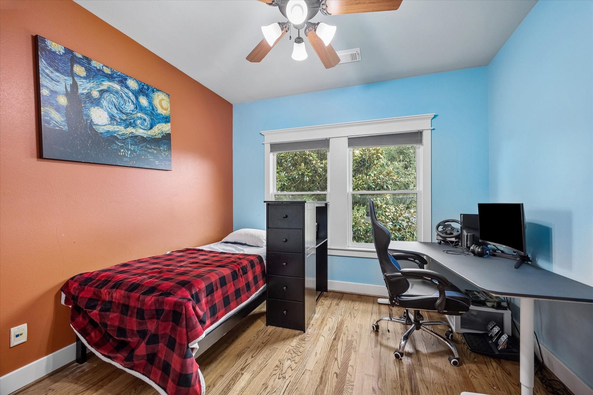 Another upstairs bedroom brings plenty of flexibility with warm wood flooring, designer paint and a large closet for storage. With easy access to a full bath, it is ready to work beautifully as a guest room, playroom or whatever fits your lifestyle best.