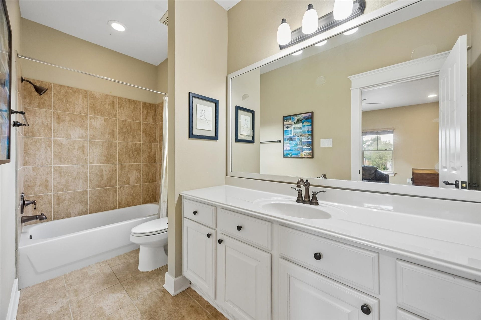 A full bath provides the garage apartment with the privacy and convenience guests will appreciate. The tiled tub and shower combination, extended granite topped vanity and easy access from the main living area make this space feel thoughtfully finished.