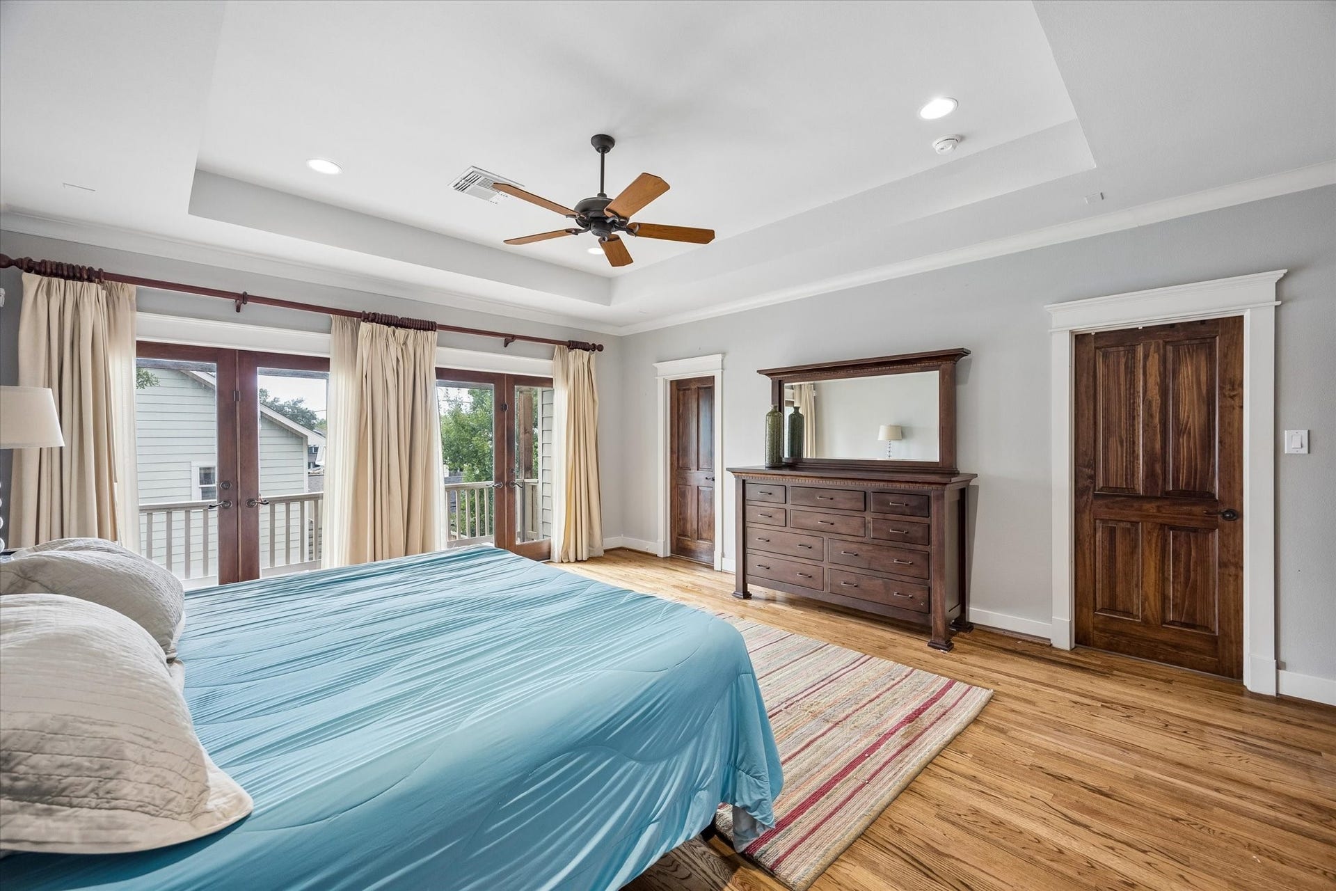 Youll have sweet dreams in this owners retreat with warm wood flooring, a raised tray ceiling and two sets of French doors that open to the backyard balcony. A custom walk-in closet and spa like ensuite complete the space with plenty of style and a little everyday luxury.