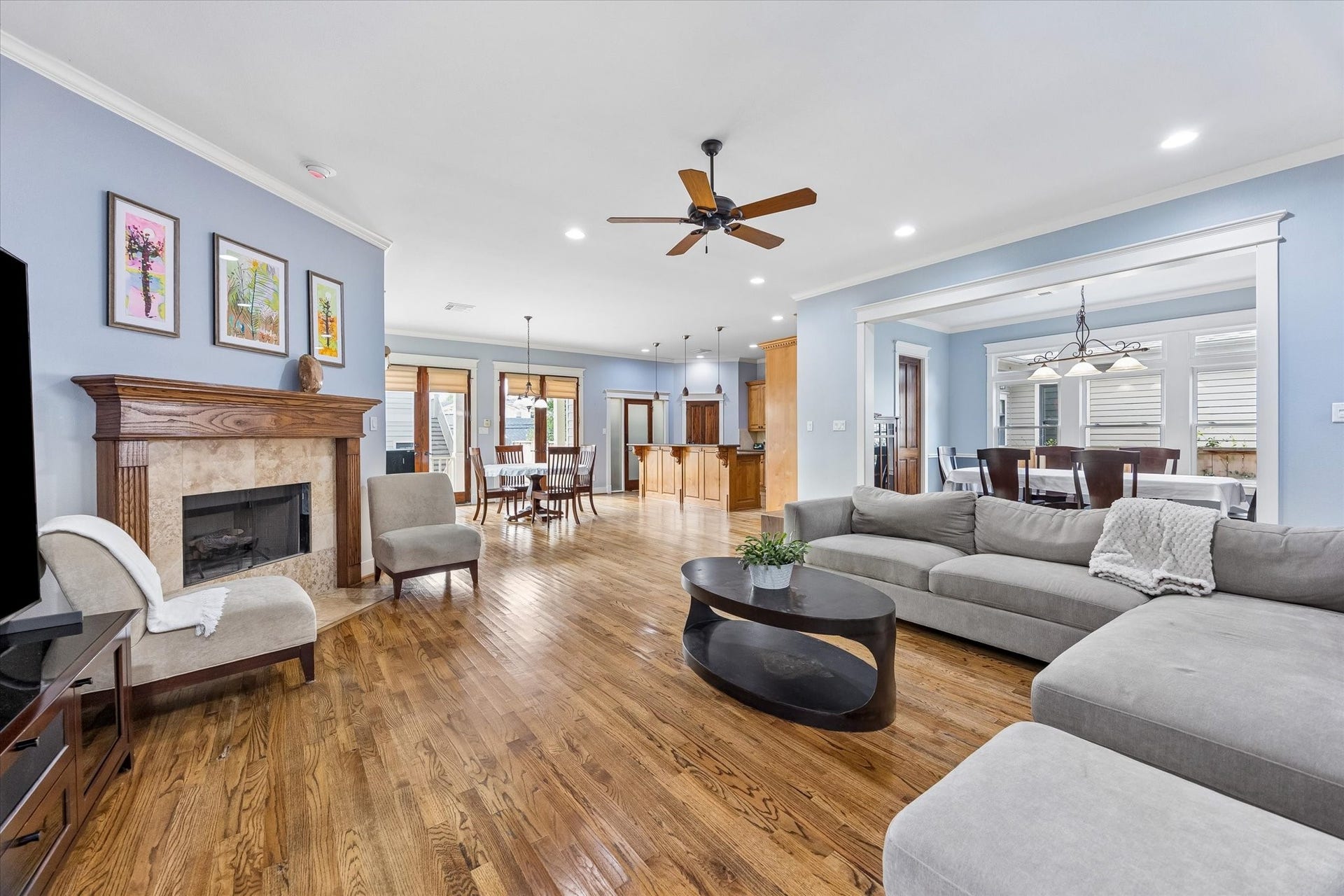 This open layout makes entertaining feel effortless, with the family room flowing into both dining areas and a spectacular island kitchen. Rich hardwood floors, tall windows, crisp millwork and a gas log fireplace bring warmth and character, while the spacious layout leaves plenty of room to gather, relax and spread out. It feels polished and comfortable, ready for everything from quiet mornings to a full house.