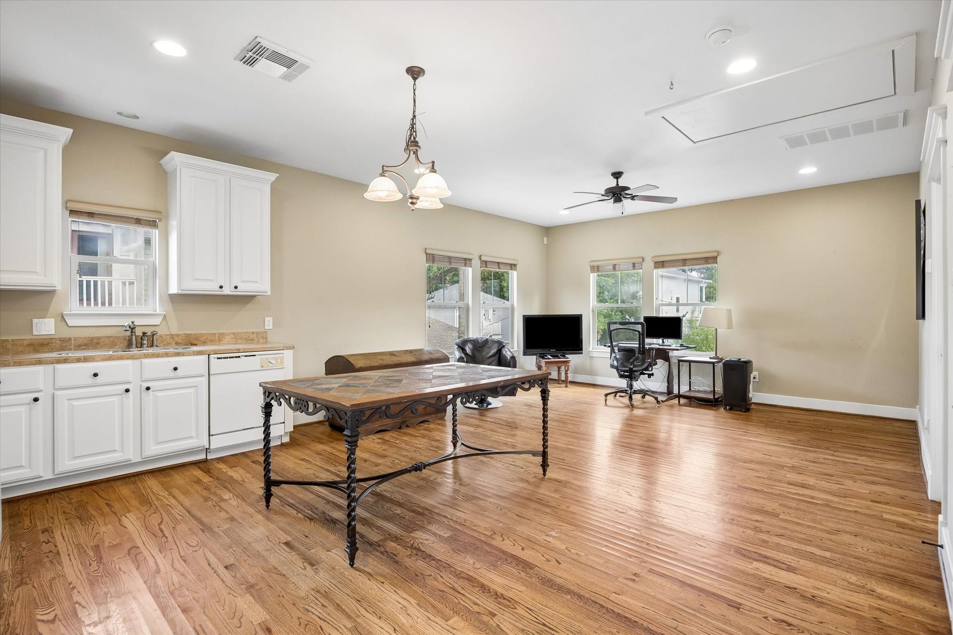 There is plenty of room to create both living and sleeping zones in this spacious garage apartment. Hardwood floors, scattered windows, its own kitchen and a full bathroom make the space comfortable, flexible and easy to make feel like home.