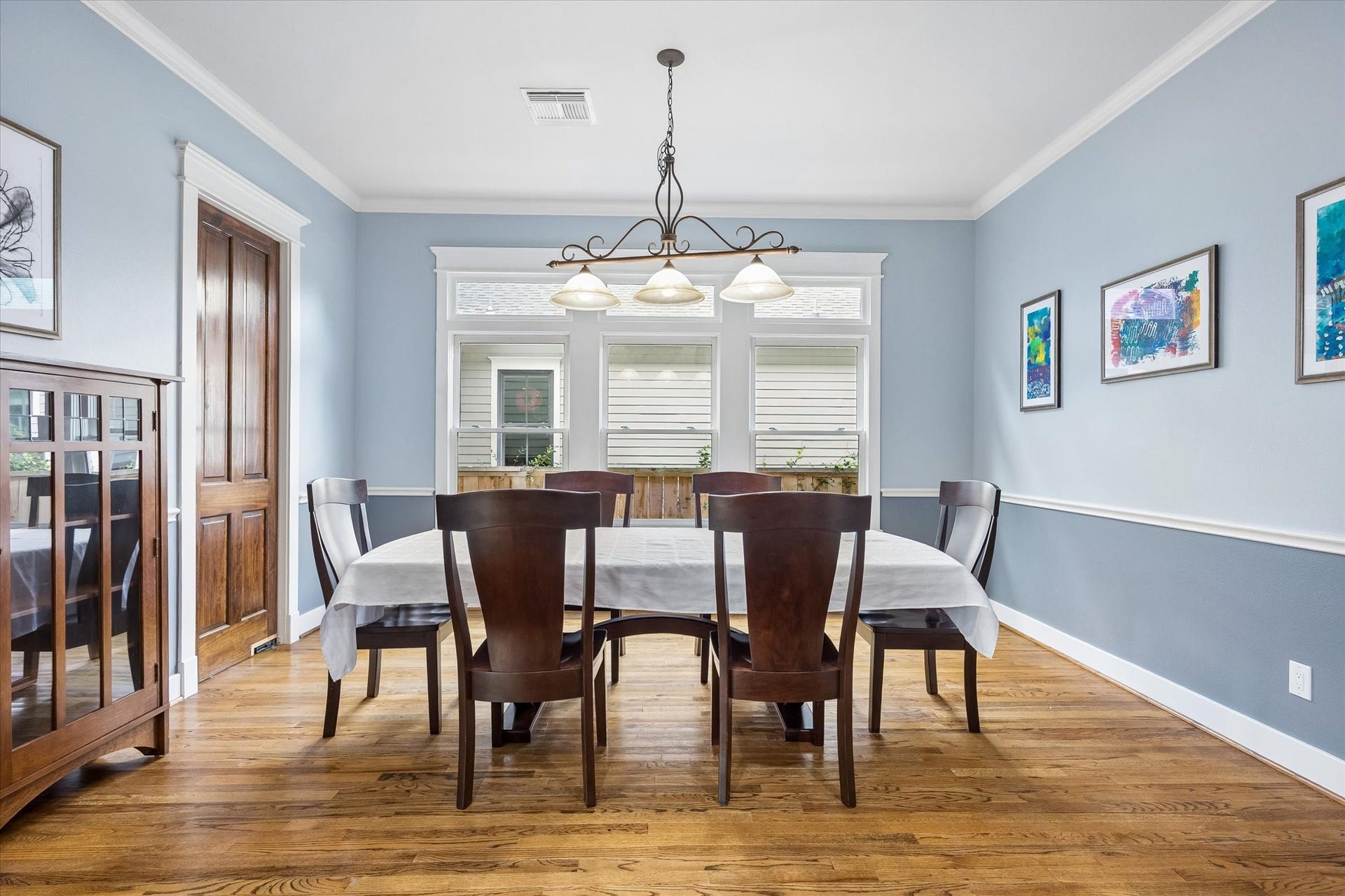 Lavish dinner parties, holiday meals or just making a Tuesday night feel a little more special, this formal dining room is ready for it all. Hardwood flooring, tall windows, crown molding and a soft, soothing palette create an inviting backdrop for every gathering around the table.