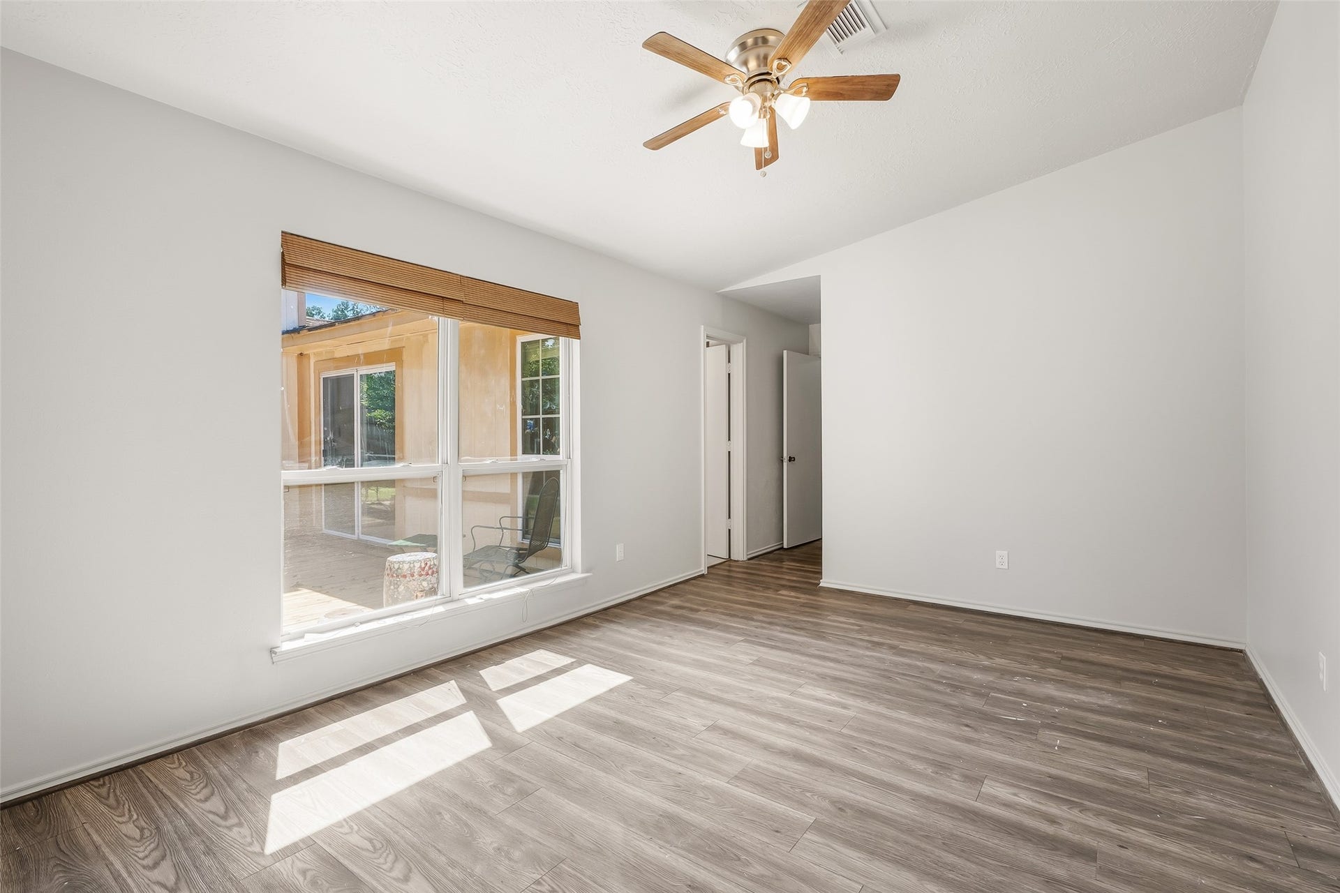 25806 Old Carriage Lane, Spring, TX 77373 Bright and airy room featuring large windows. Perfect for a bedroom or home office.