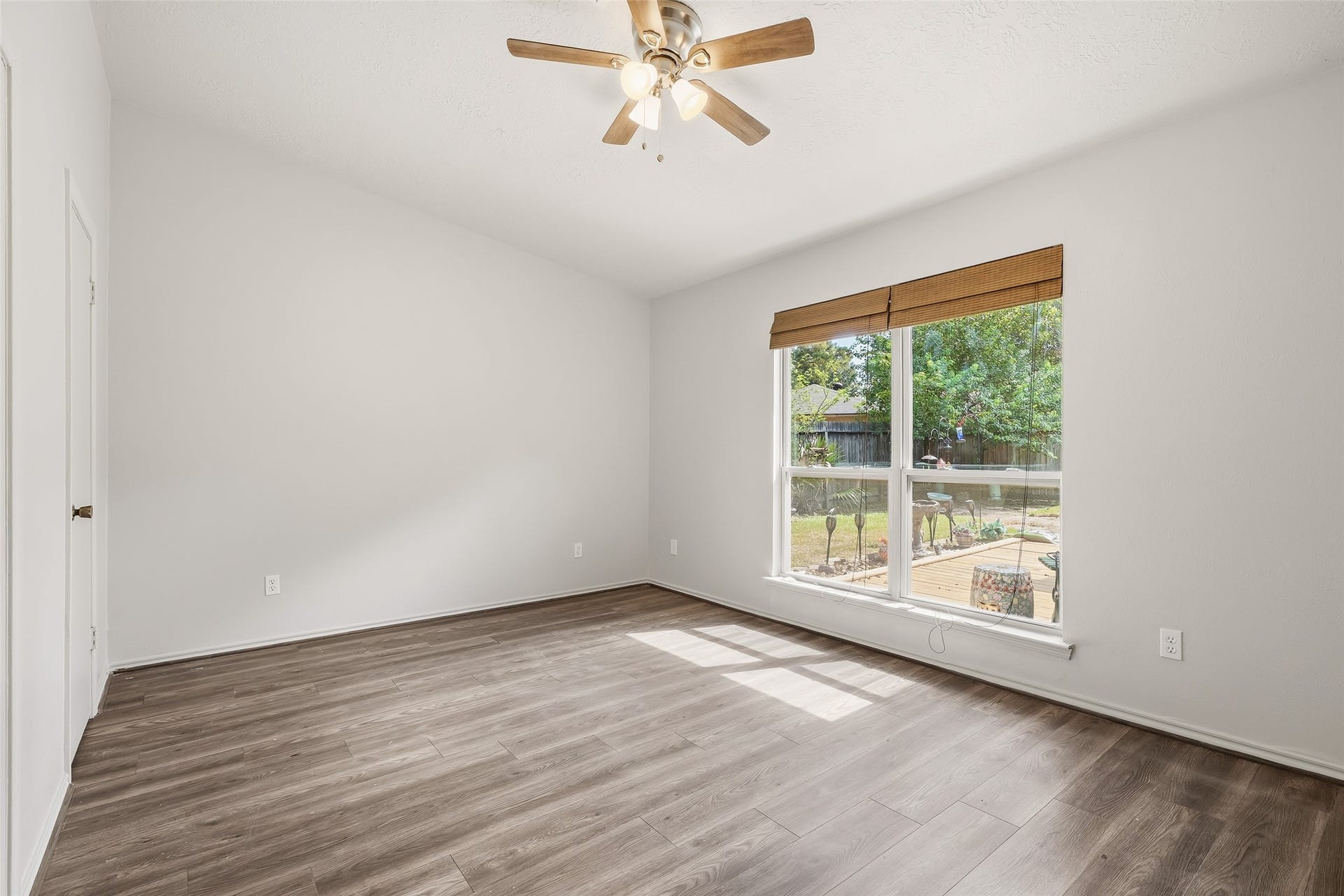 25806 Old Carriage Lane, Spring, TX 77373 Additional bedroom featuring abundant natural light and a view of the backyard.