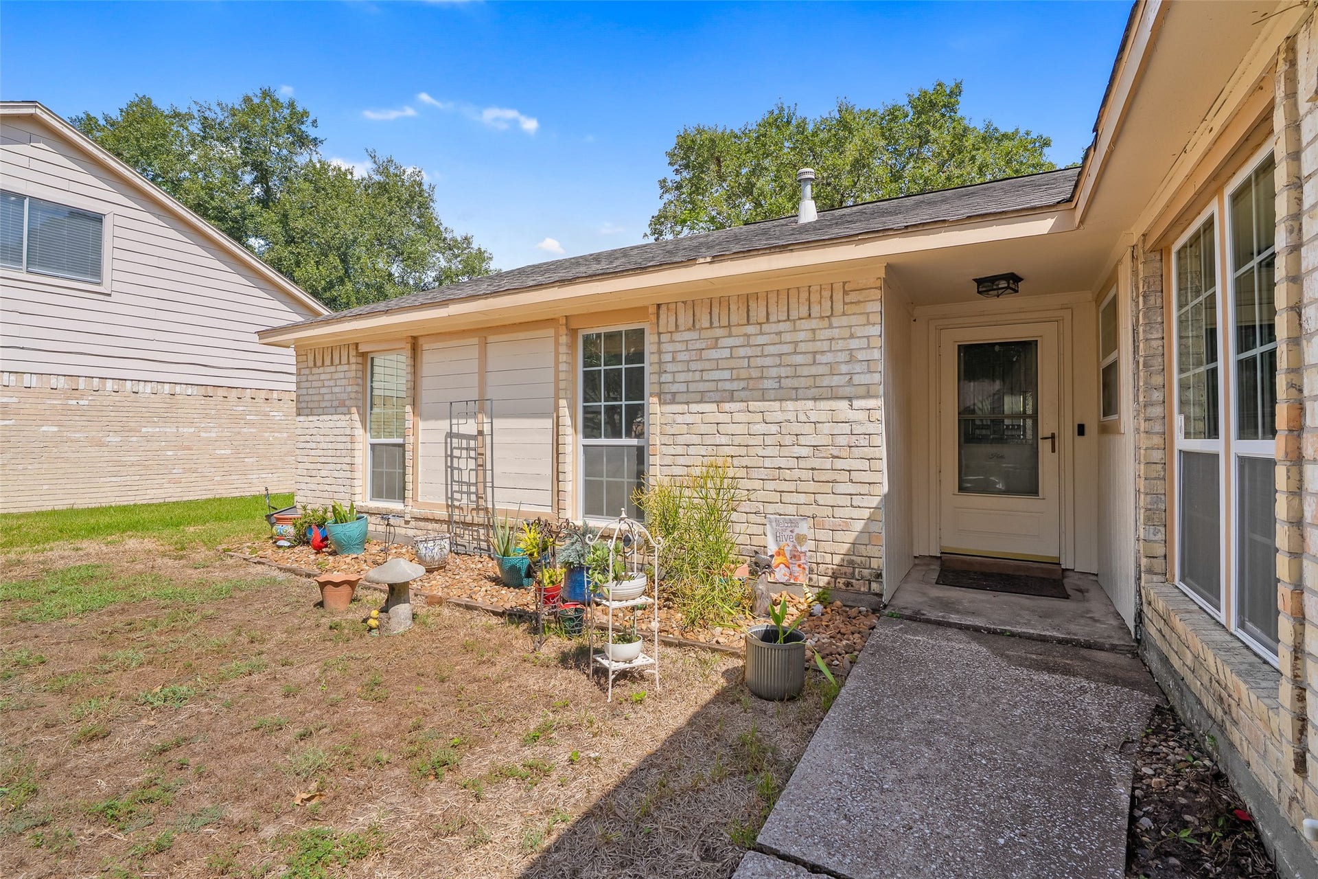 25806 Old Carriage Lane, Spring, TX 77373 Welcome guests under the covered entryway.