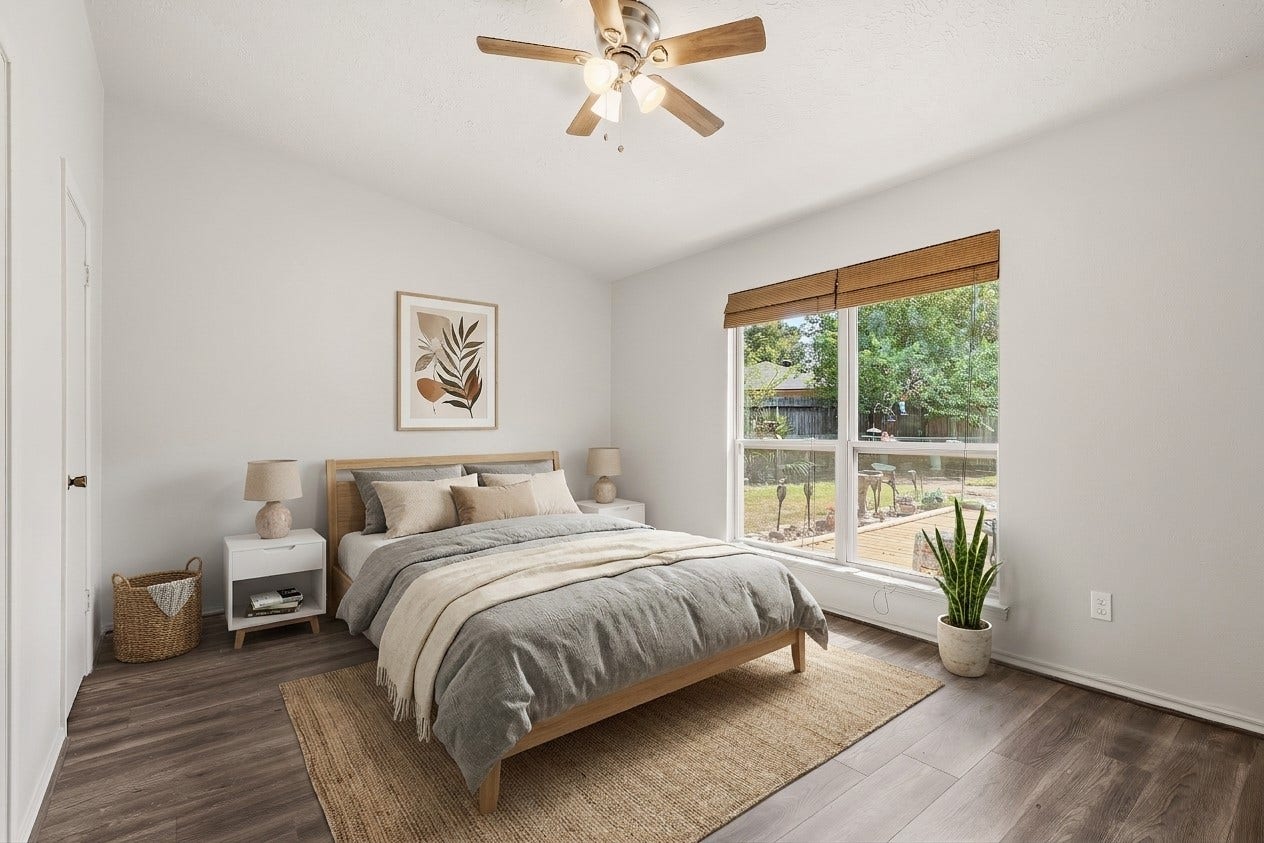 25806 Old Carriage Lane, Spring, TX 77373 Additional bedroom featuring abundant natural light and a view of the backyard. This image is AI enhanced.