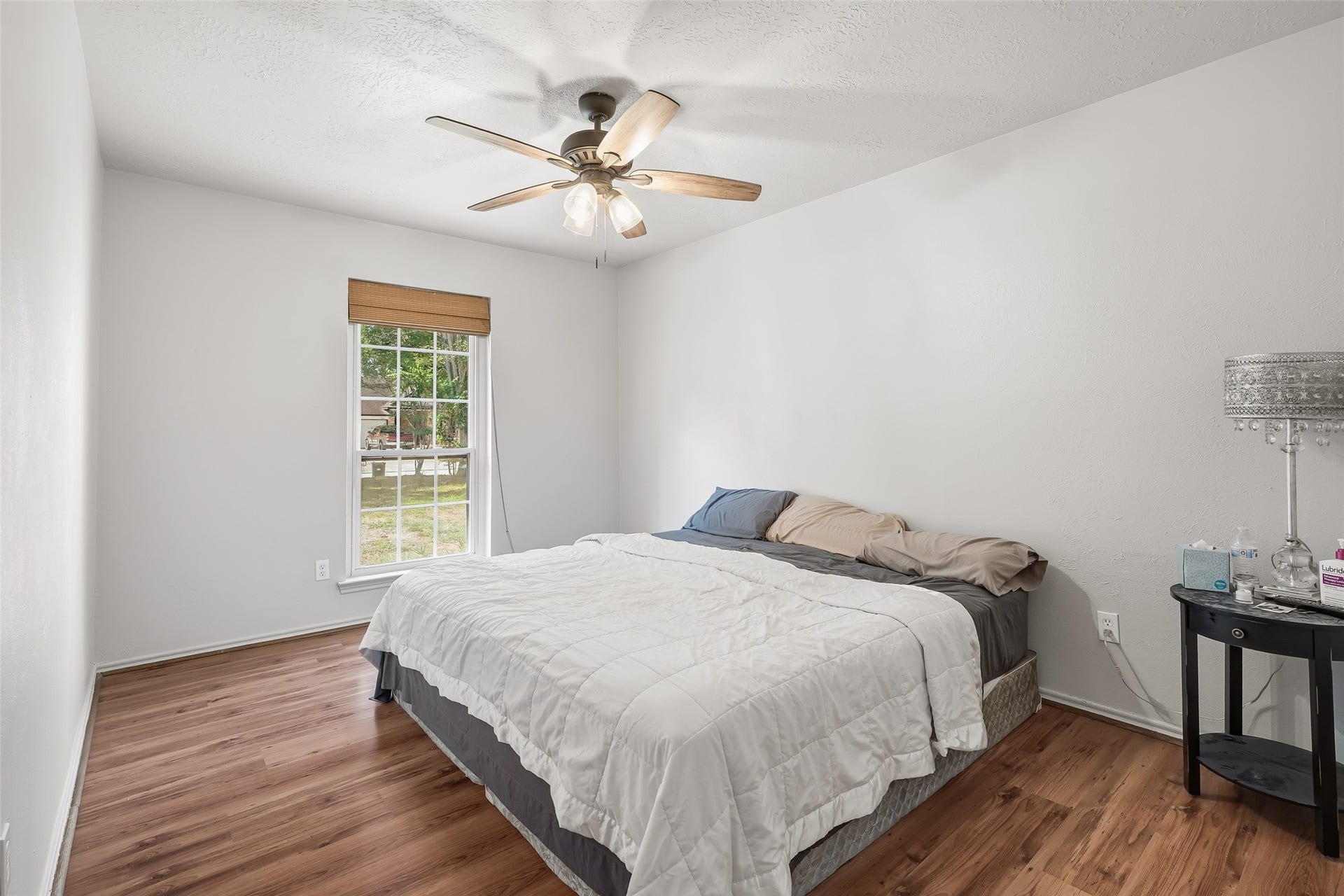 25806 Old Carriage Lane, Spring, TX 77373 Another bedroom featuring neutral tones, a ceiling fan and a large window for natural light.