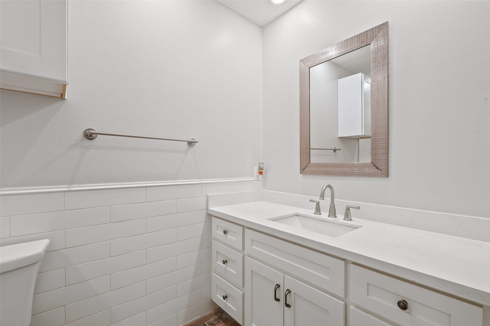 25806 Old Carriage Lane, Spring, TX 77373 Bright, modern bathroom with sleek white cabinetry and elegant fixtures.