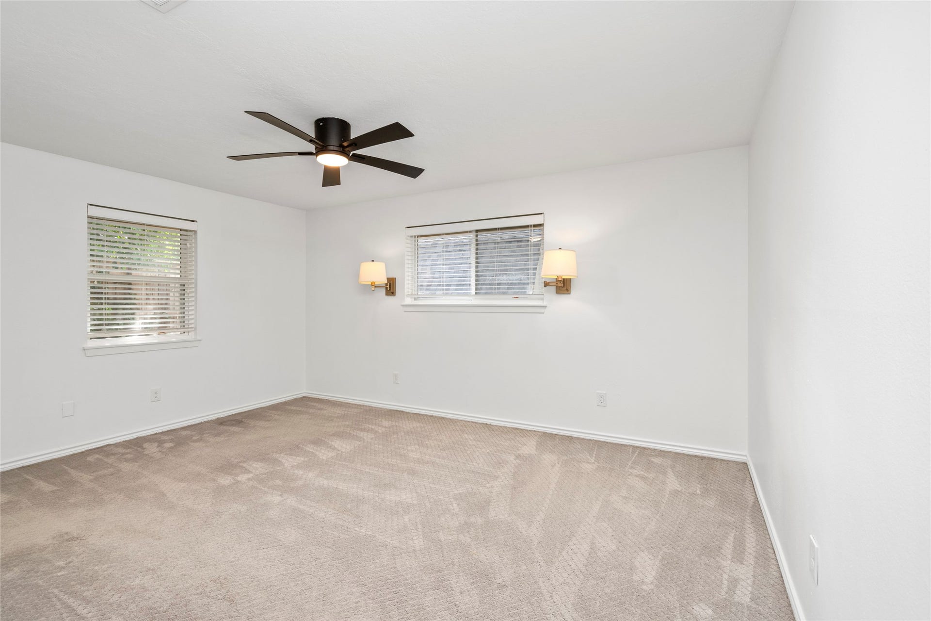 10519 Londonderry Drive, Houston, TX 77043 The primary bedroom sits at the back corner of the home offering privacy and a full ensuite